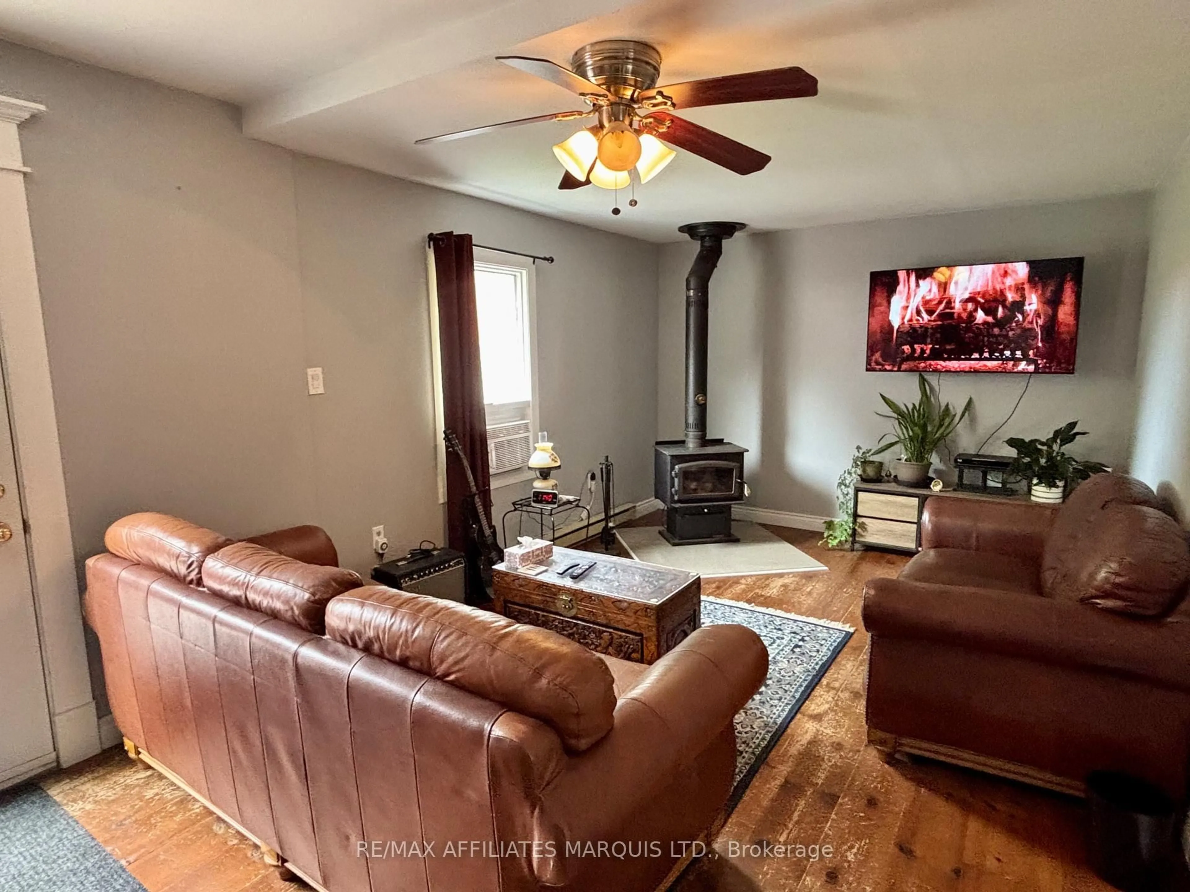Living room with furniture, wood/laminate floor for 452 Dominion St St, North Glengarry Ontario K0C 1A0