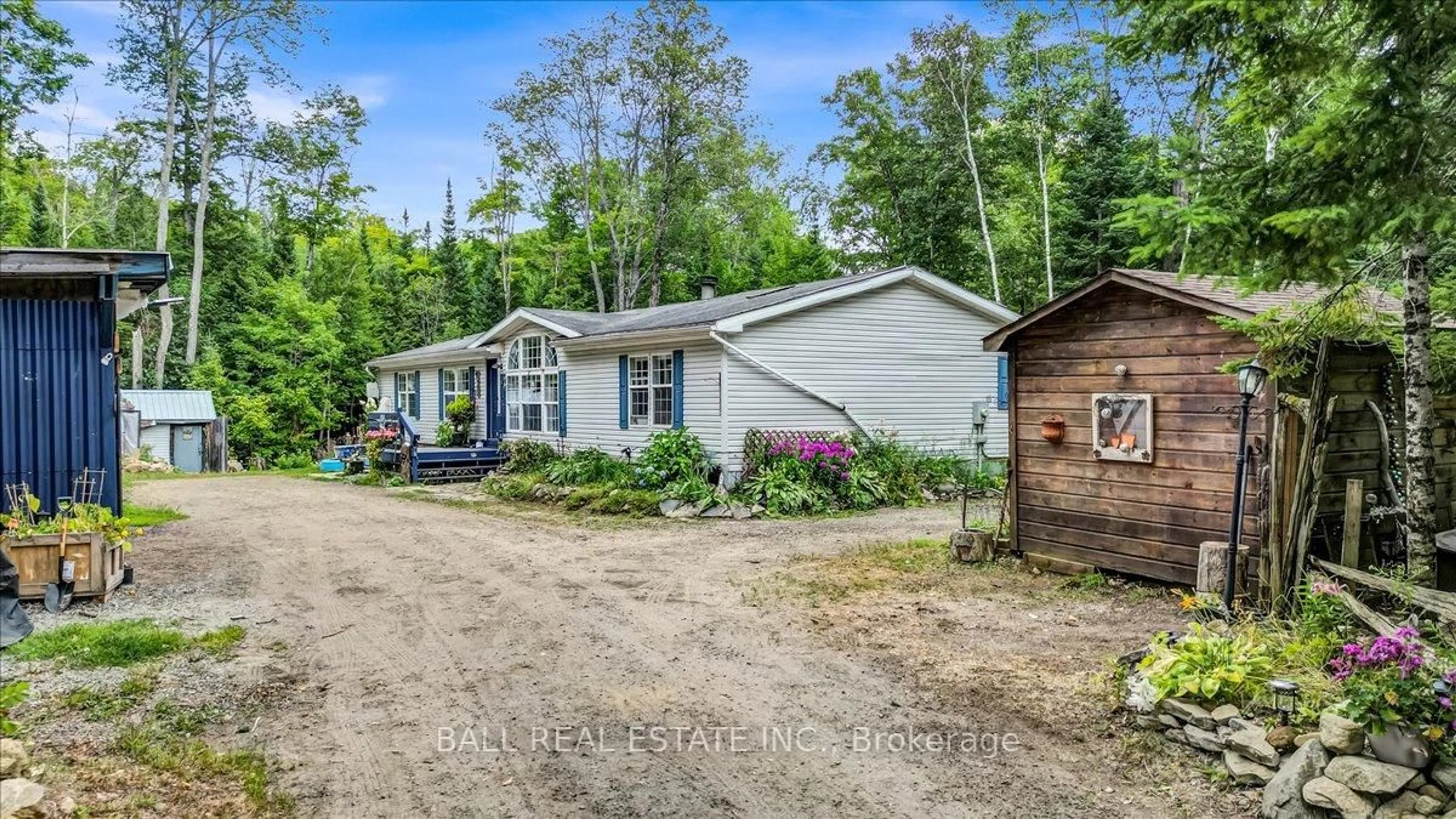 A pic from outside/outdoor area/front of a property/back of a property/a pic from drone, street for 5005 Loop Rd, Highlands East Ontario K0L 2A0