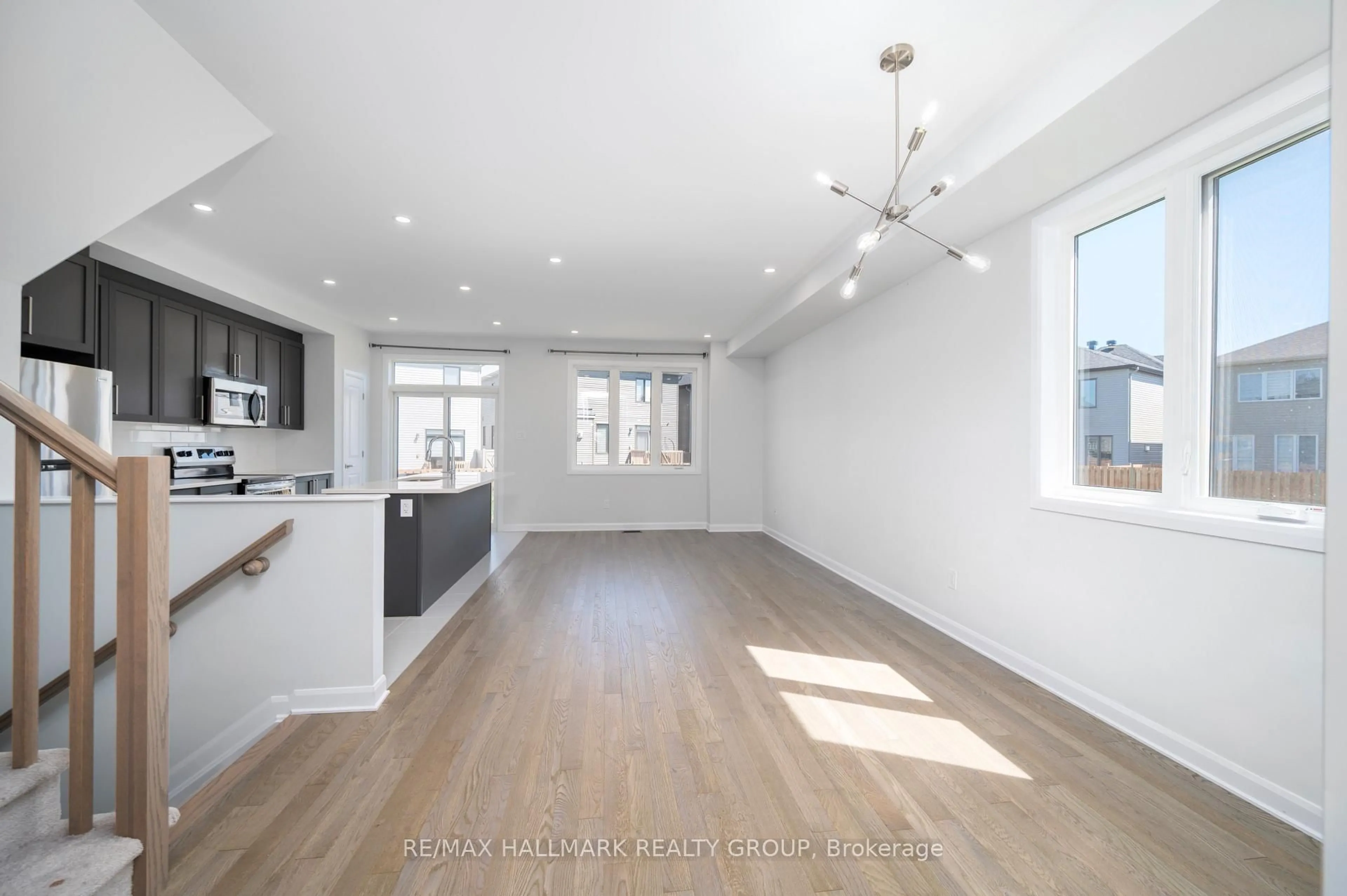 Open concept kitchen, wood/laminate floor for 315 Blossom Pass Terr, Ottawa Ontario K4A 5P1