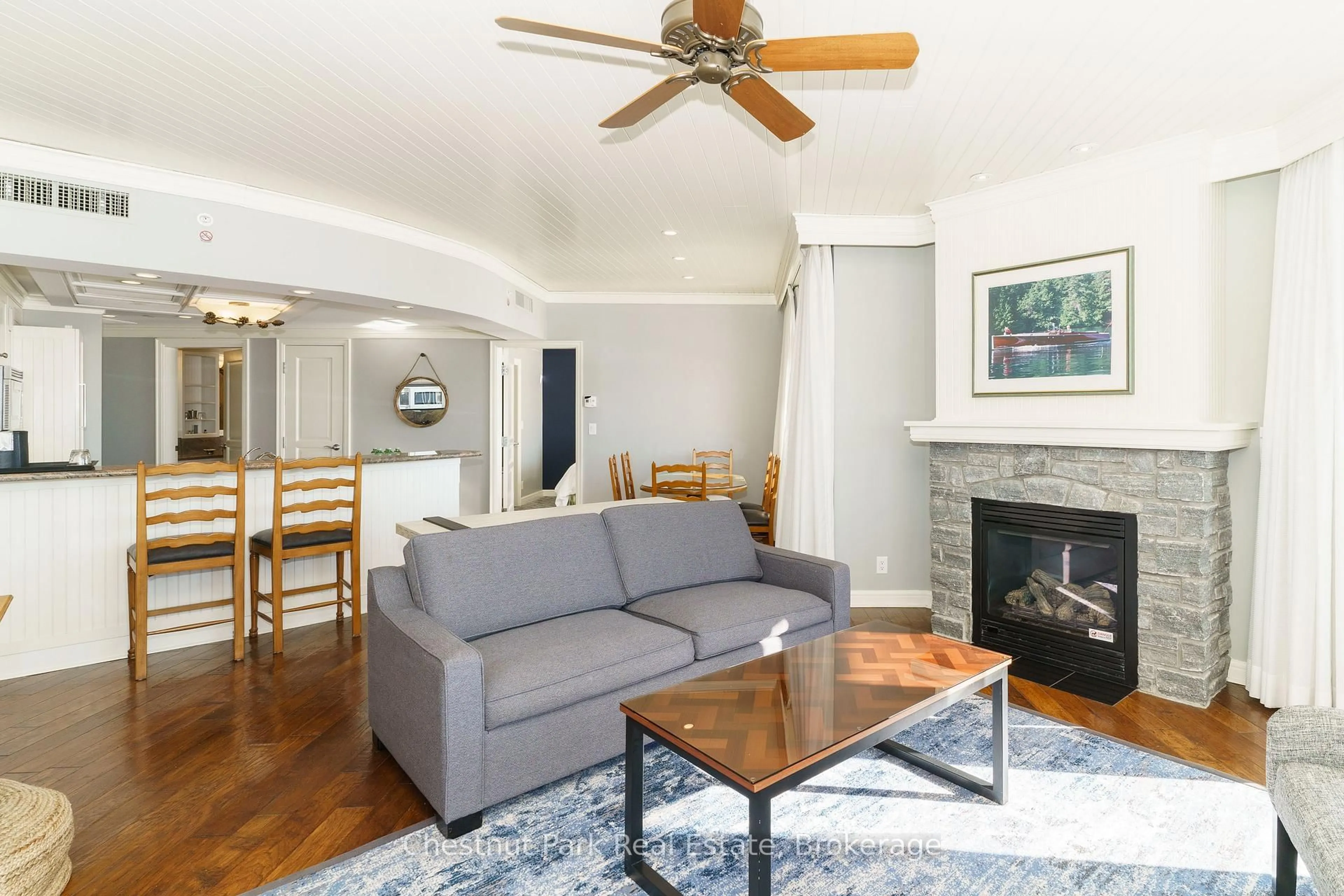 Living room with furniture, wood/laminate floor for 1050 Paignton House Rd #S243, Muskoka Lakes Ontario P0B 1G0