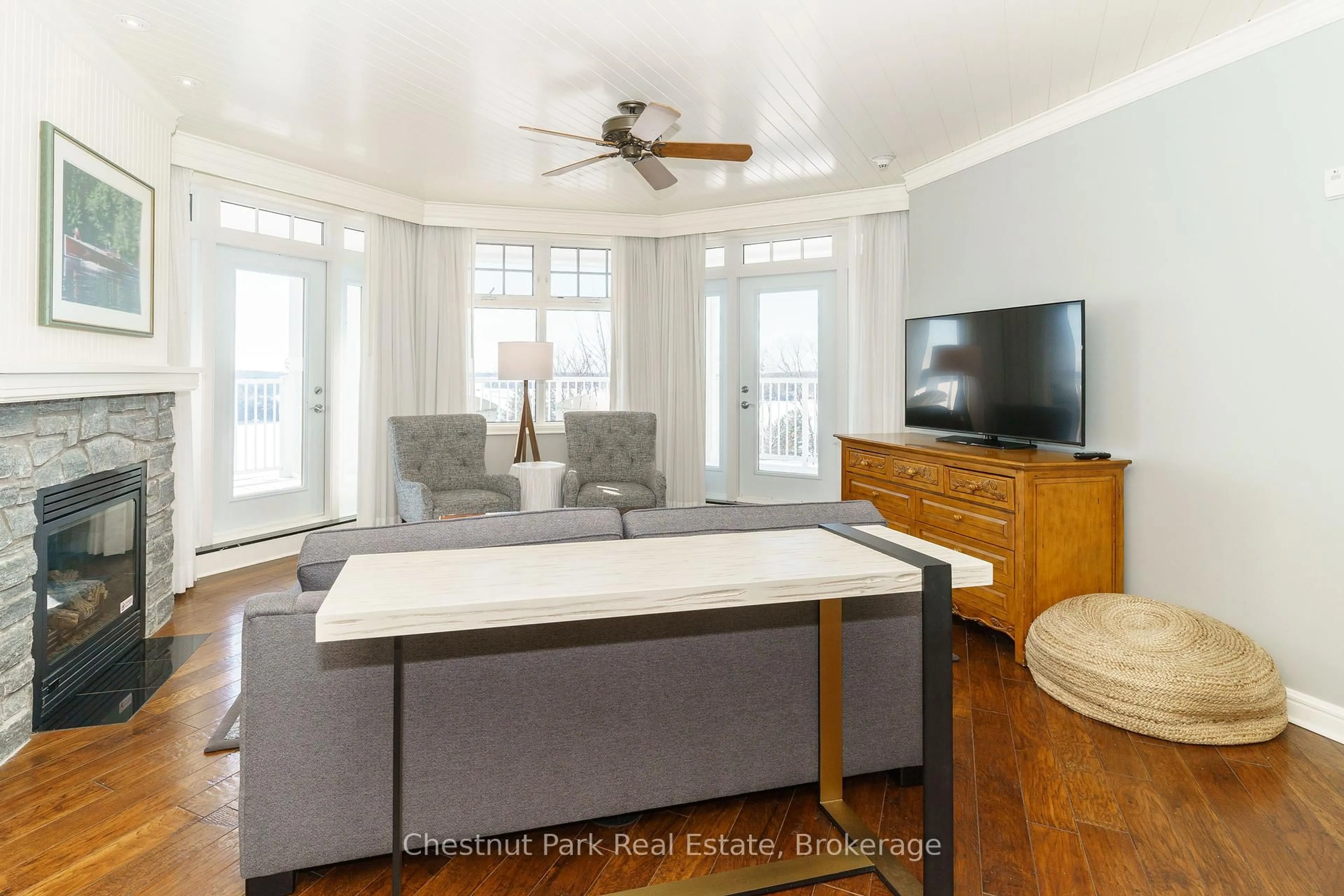 Living room with furniture, wood/laminate floor for 1050 Paignton House Rd #S243, Muskoka Lakes Ontario P0B 1G0