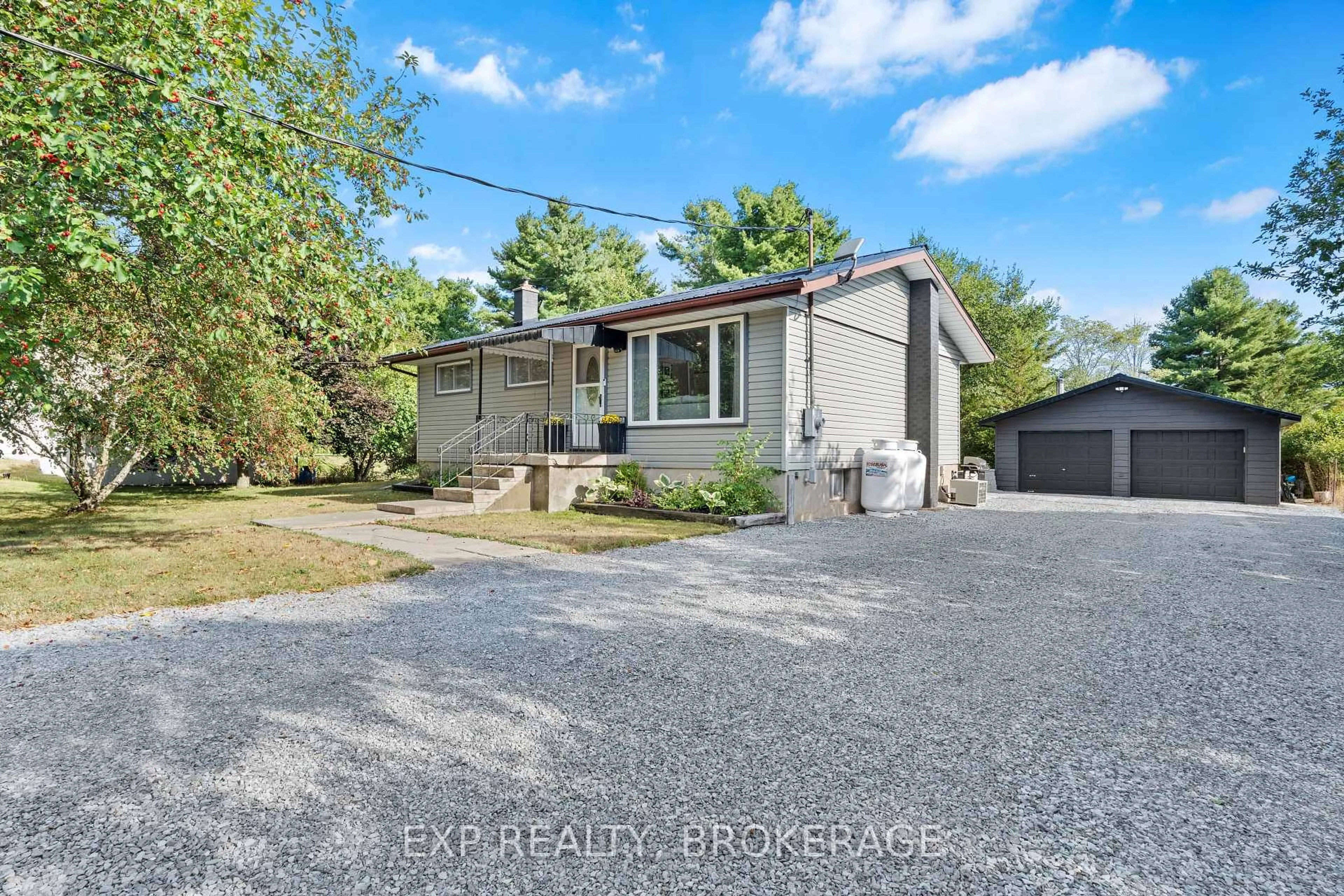 A pic from outside/outdoor area/front of a property/back of a property/a pic from drone, street for 3858 QUINN Rd, Harrowsmith Ontario K0H 1V0