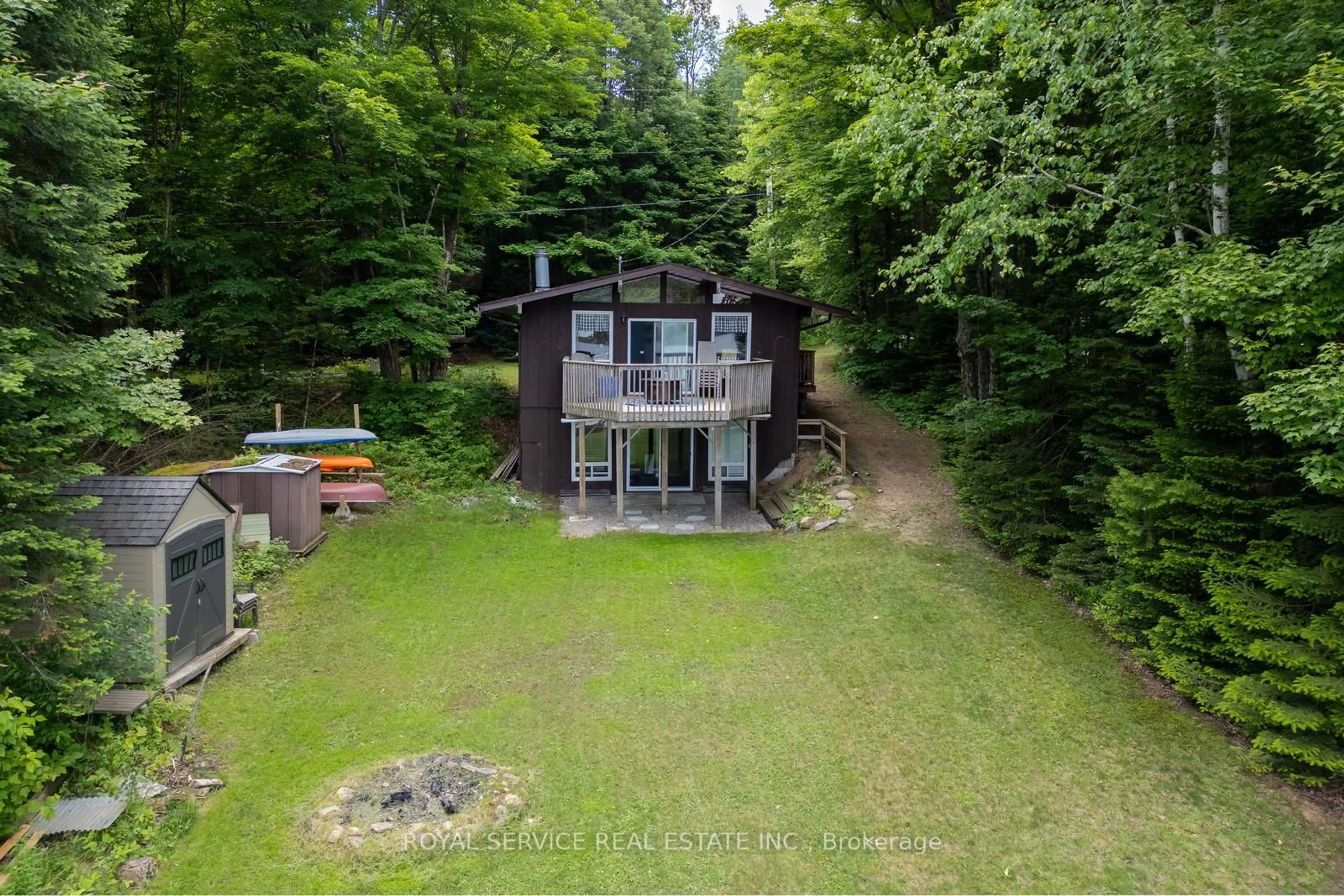 A pic from outside/outdoor area/front of a property/back of a property/a pic from drone, water/lake/river/ocean view for 2104 Brady Lake Rd, Minden Hills Ontario K0M 2K0