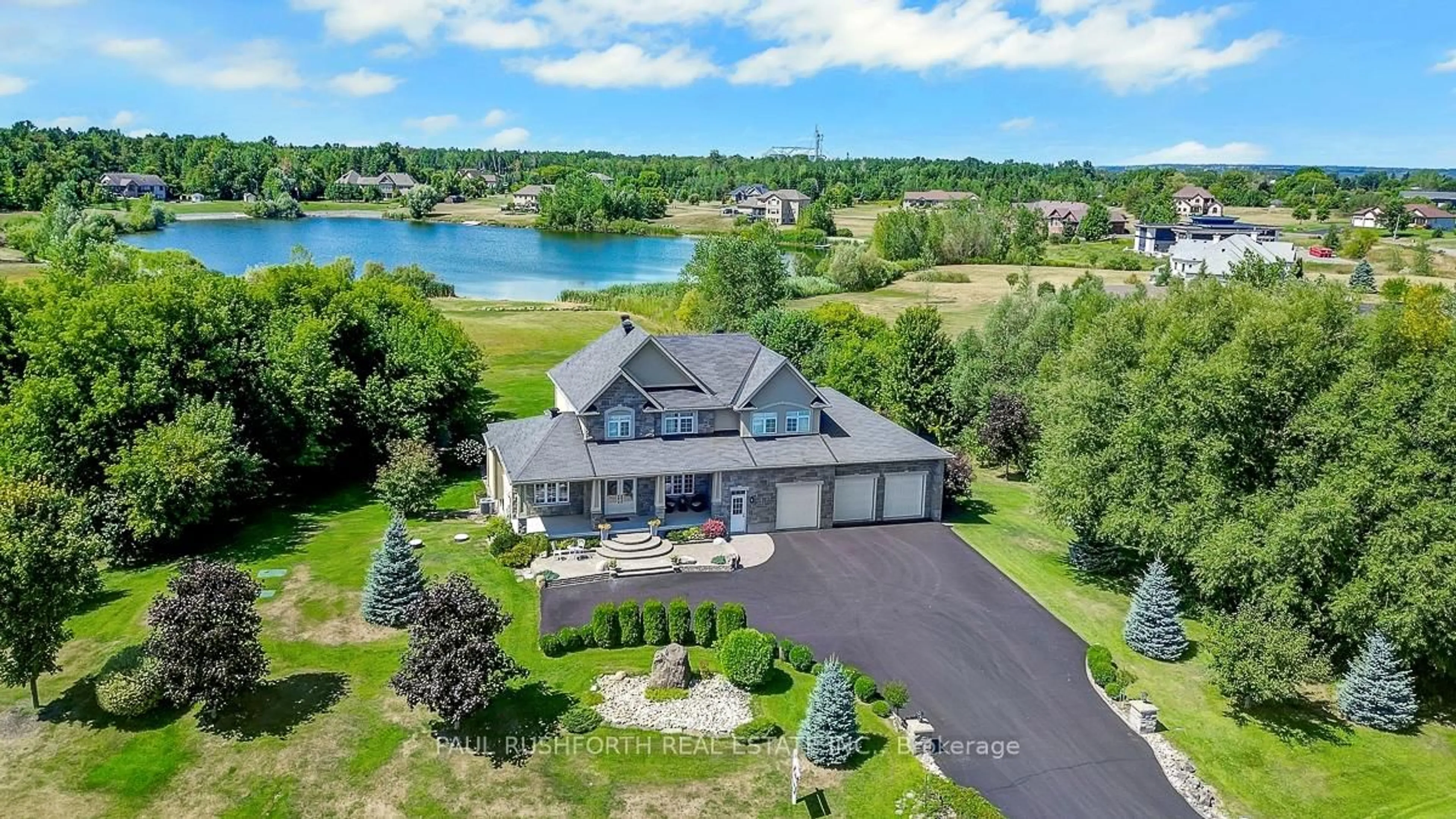 A pic from outside/outdoor area/front of a property/back of a property/a pic from drone, water/lake/river/ocean view for 365 West Lake Circ, Carp Ontario K0A 1L0
