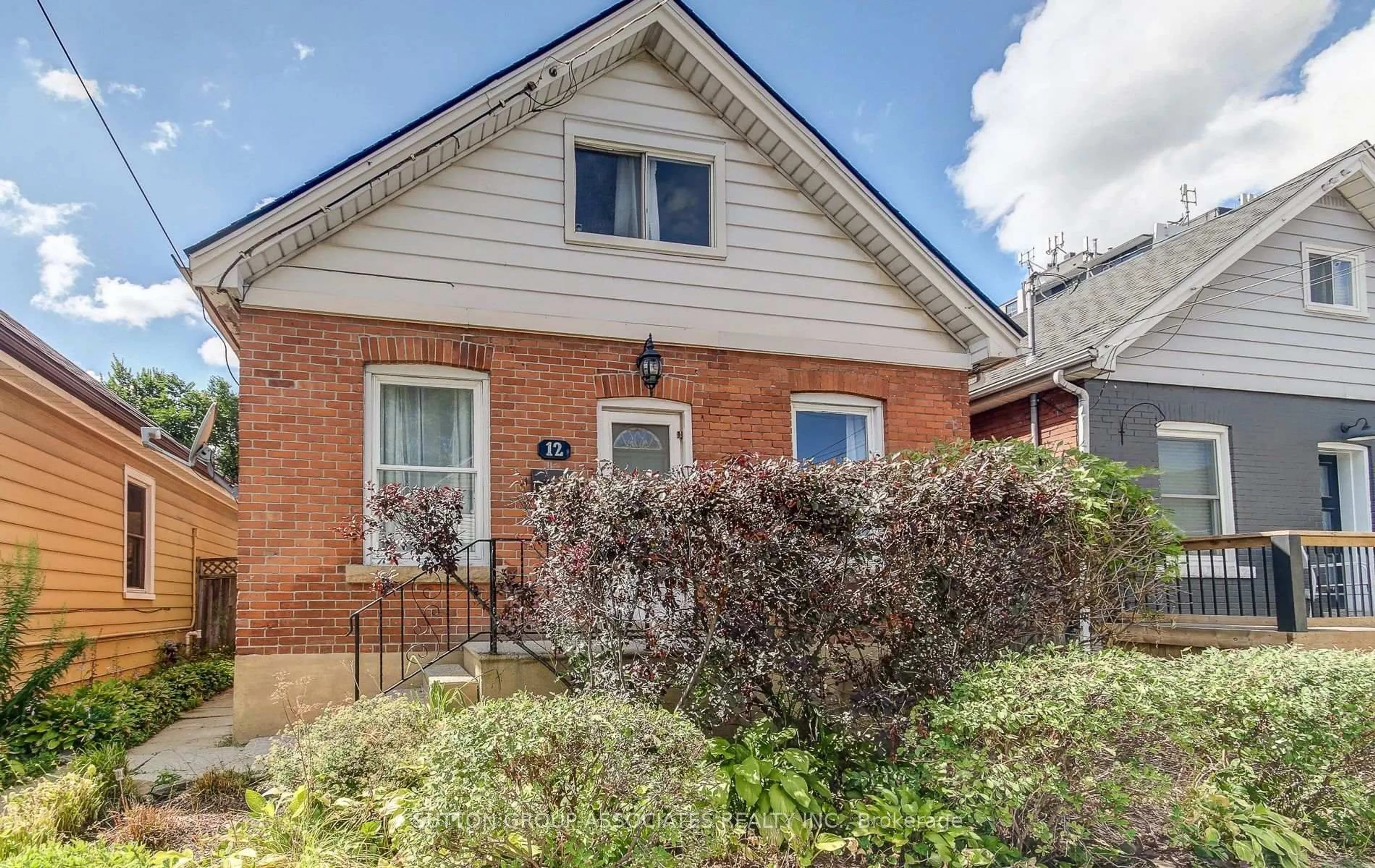 Home with brick exterior material, street for 12 East 25th St, Hamilton Ontario L8V 3A1