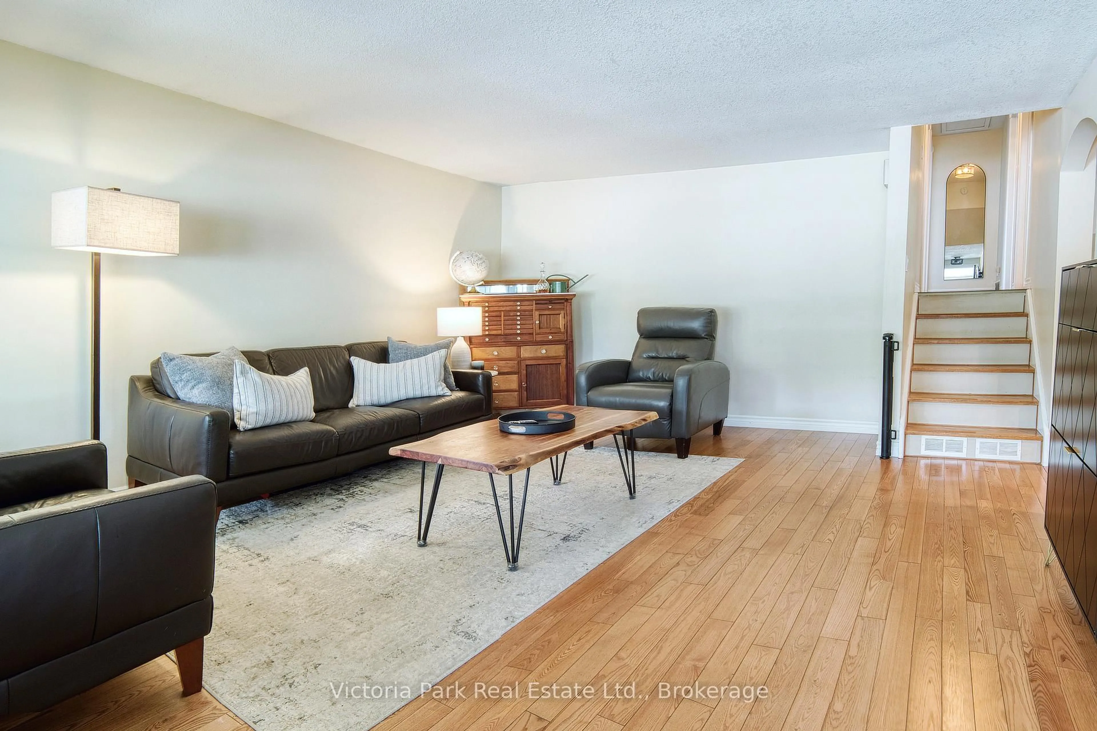 Living room with furniture, wood/laminate floor for 661 Glen Forrest Blvd, Waterloo Ontario N2L 4K4