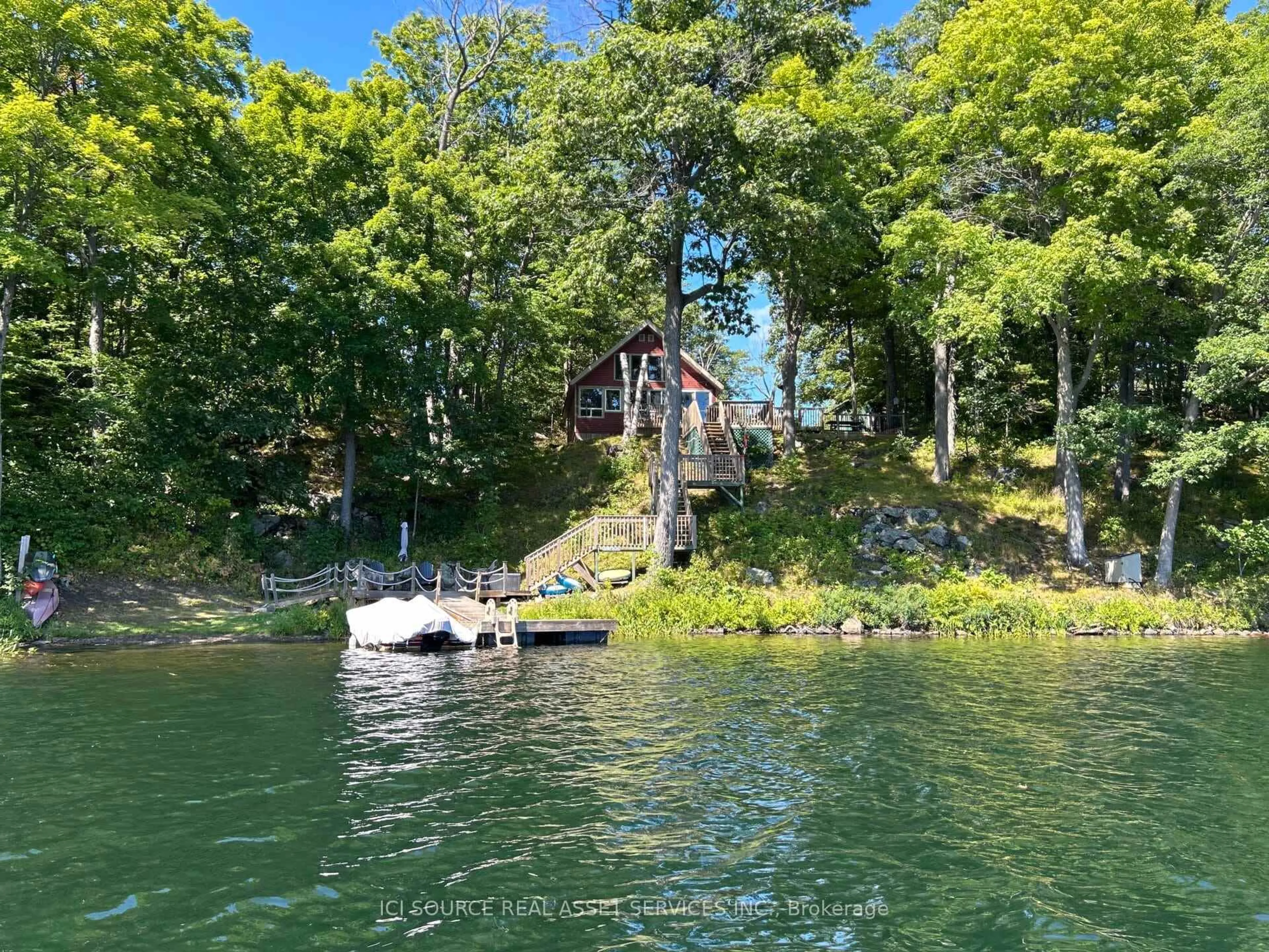 A pic from outside/outdoor area/front of a property/back of a property/a pic from drone, water/lake/river/ocean view for 118 Pero Lane, Hartington Ontario K0H 1W0