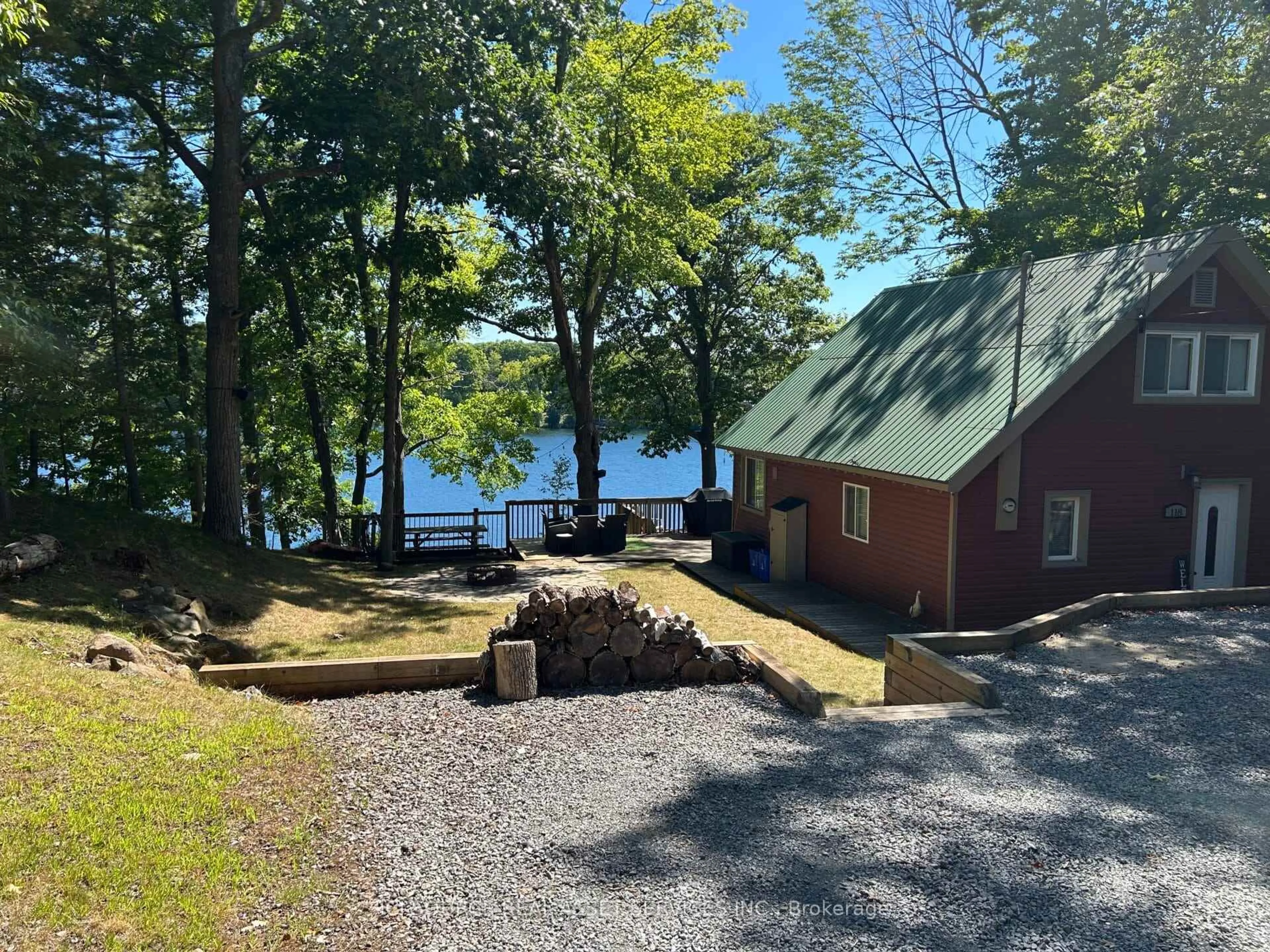 A pic from outside/outdoor area/front of a property/back of a property/a pic from drone, water/lake/river/ocean view for 118 Pero Lane, Hartington Ontario K0H 1W0