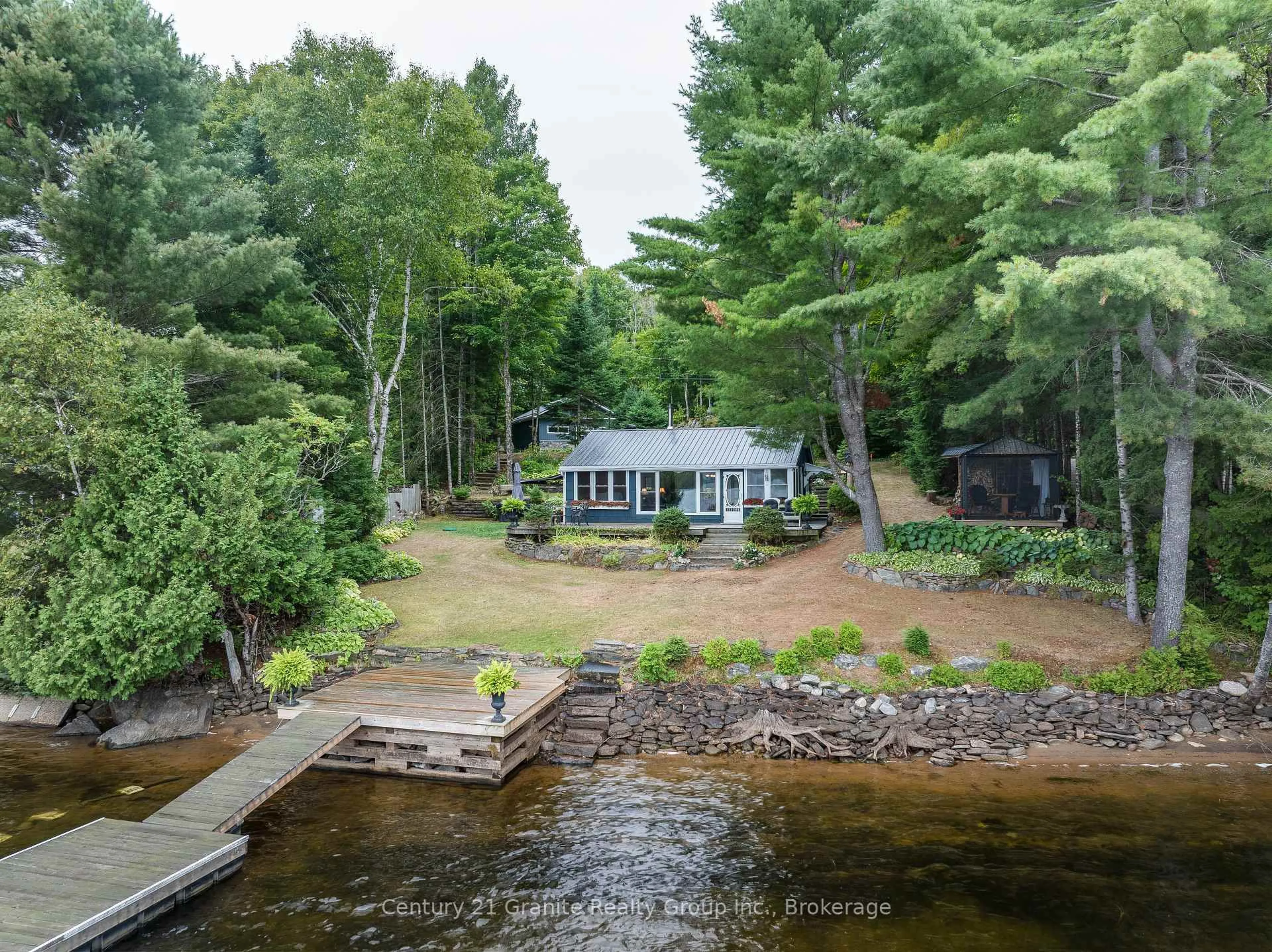 A pic from outside/outdoor area/front of a property/back of a property/a pic from drone, water/lake/river/ocean view for 1528 Dignan Rd, Dysart et al Ontario K0M 1S0