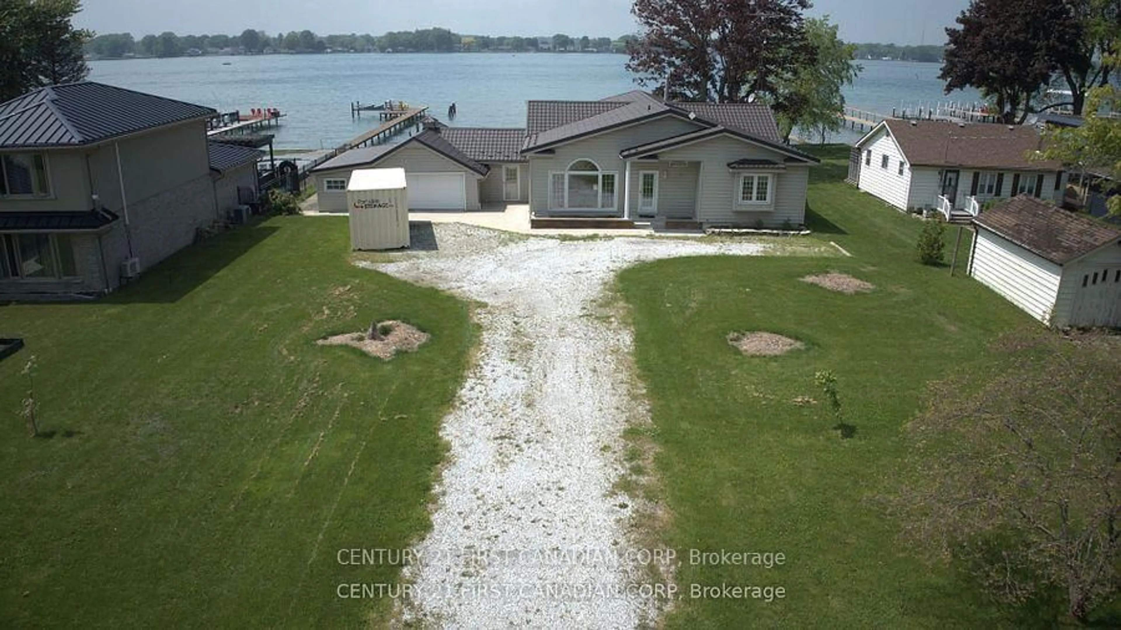 A pic from outside/outdoor area/front of a property/back of a property/a pic from drone, water/lake/river/ocean view for 3877 St Clair Pkwy, St. Clair Ontario N0P 2B0