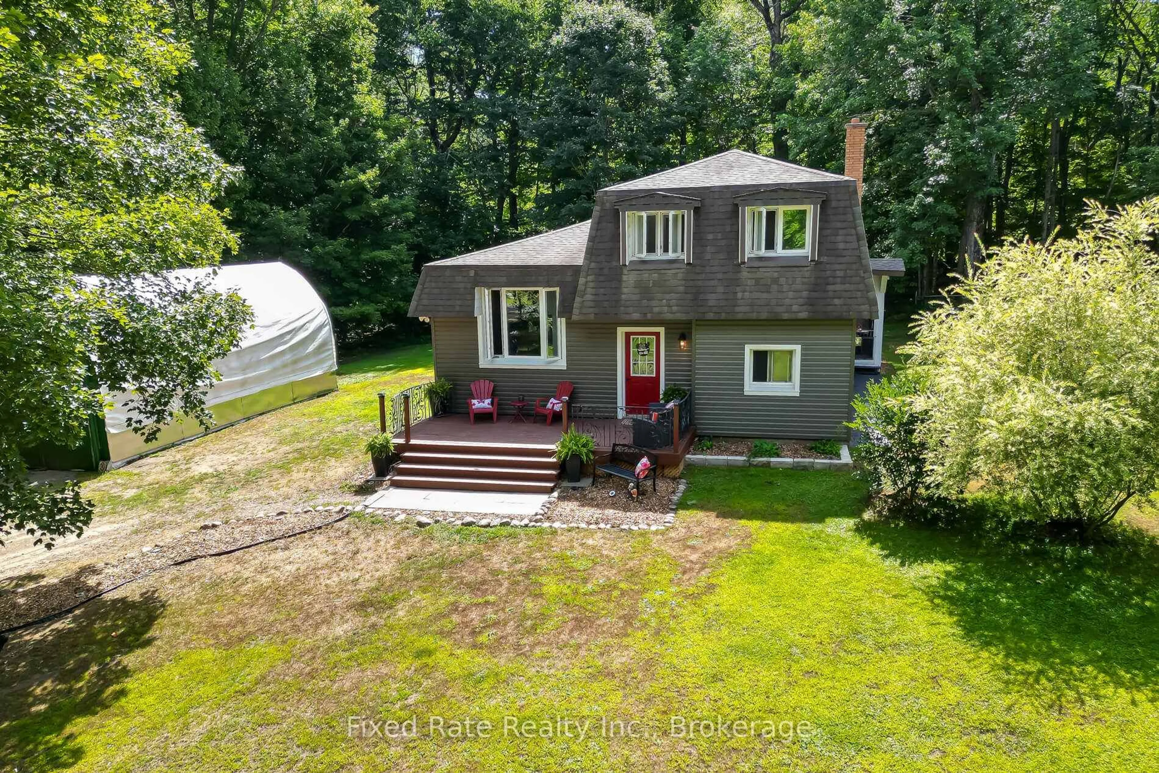 A pic from outside/outdoor area/front of a property/back of a property/a pic from drone, street for 128 Bridgedale Rd, Huntsville Ontario P0B 1L0