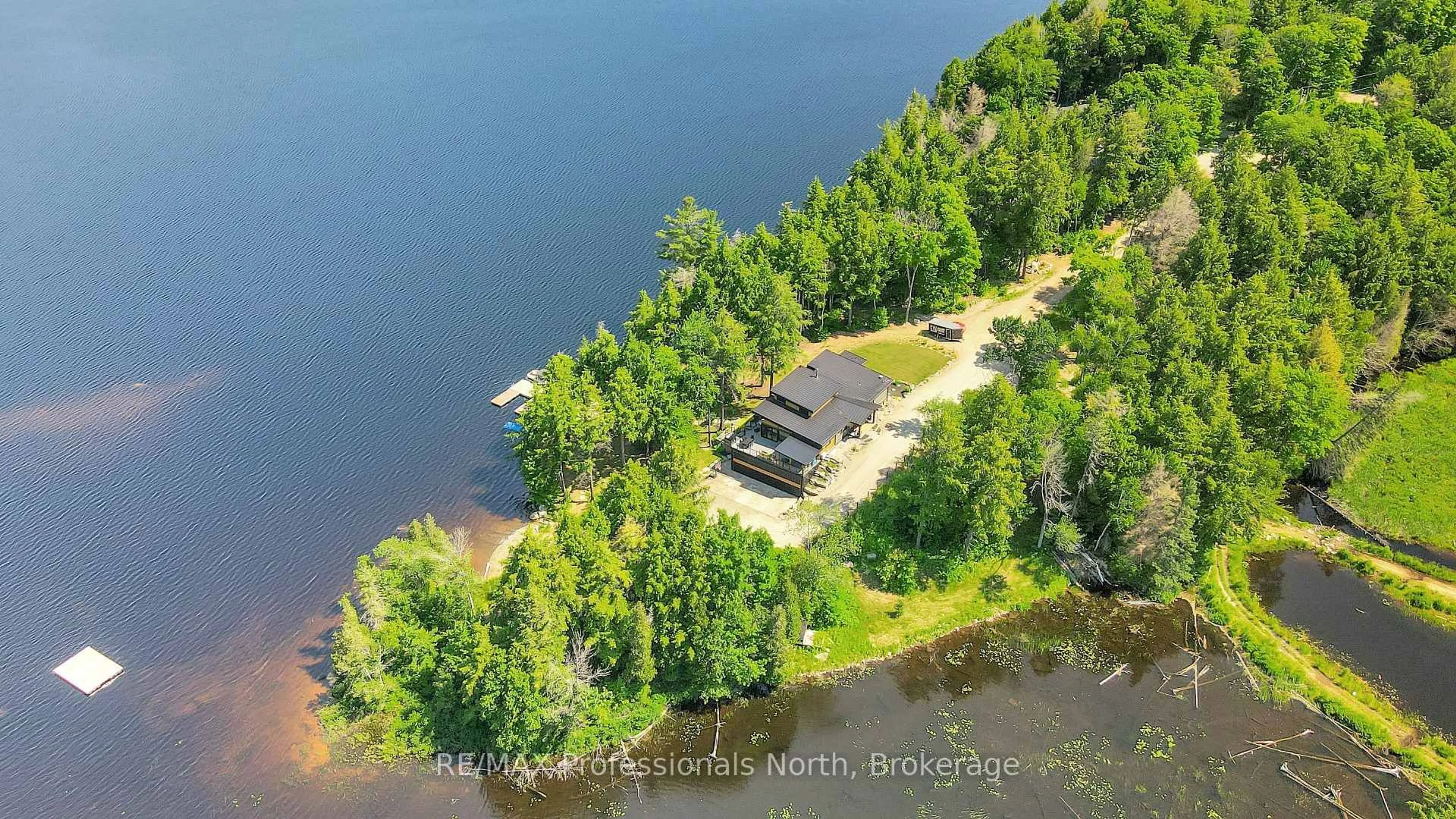 A pic from outside/outdoor area/front of a property/back of a property/a pic from drone, water/lake/river/ocean view for 1046 Lone Wolf Cres, Dysart et al Ontario K0M 1S0