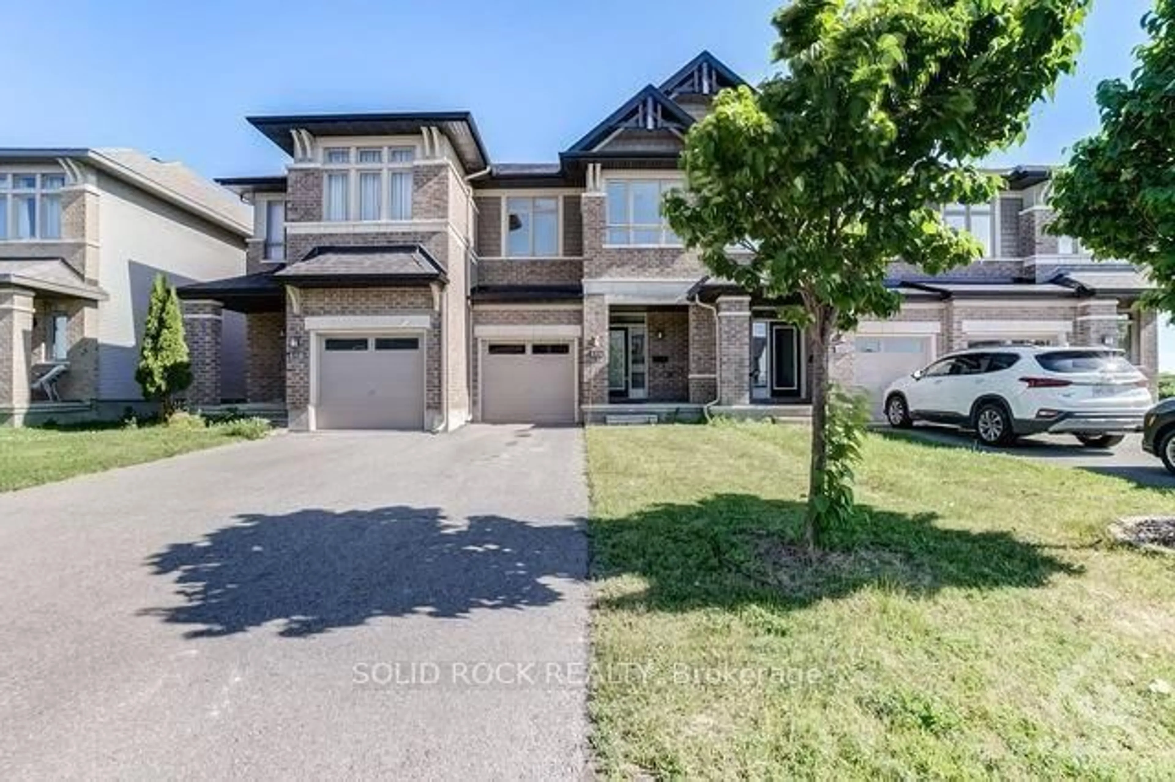 Home with brick exterior material, street for 604 Tennant Way, Ottawa Ontario K4M 0C6