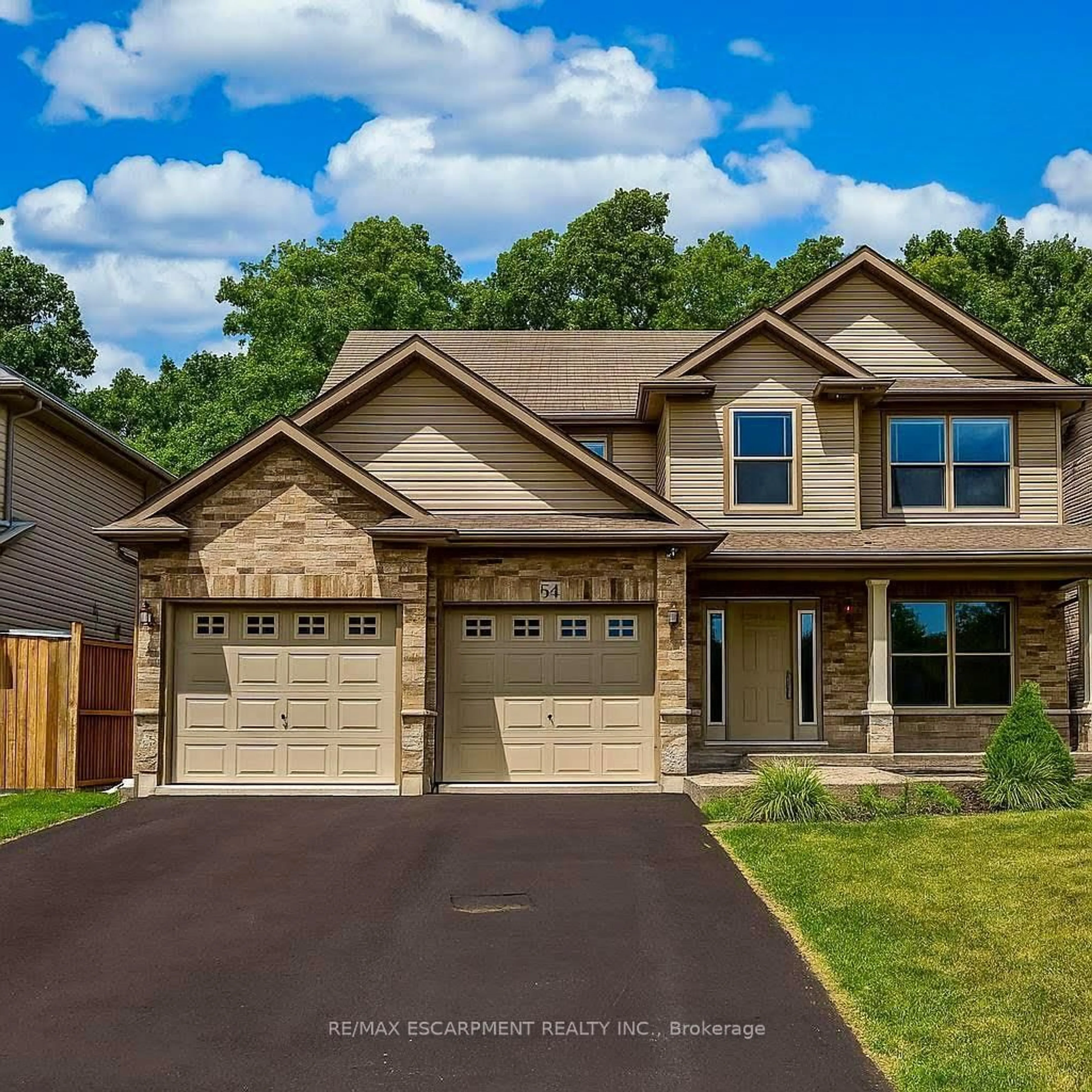 Home with brick exterior material, street for 54 Harvest Gate, West Lincoln Ontario L0R 2A0