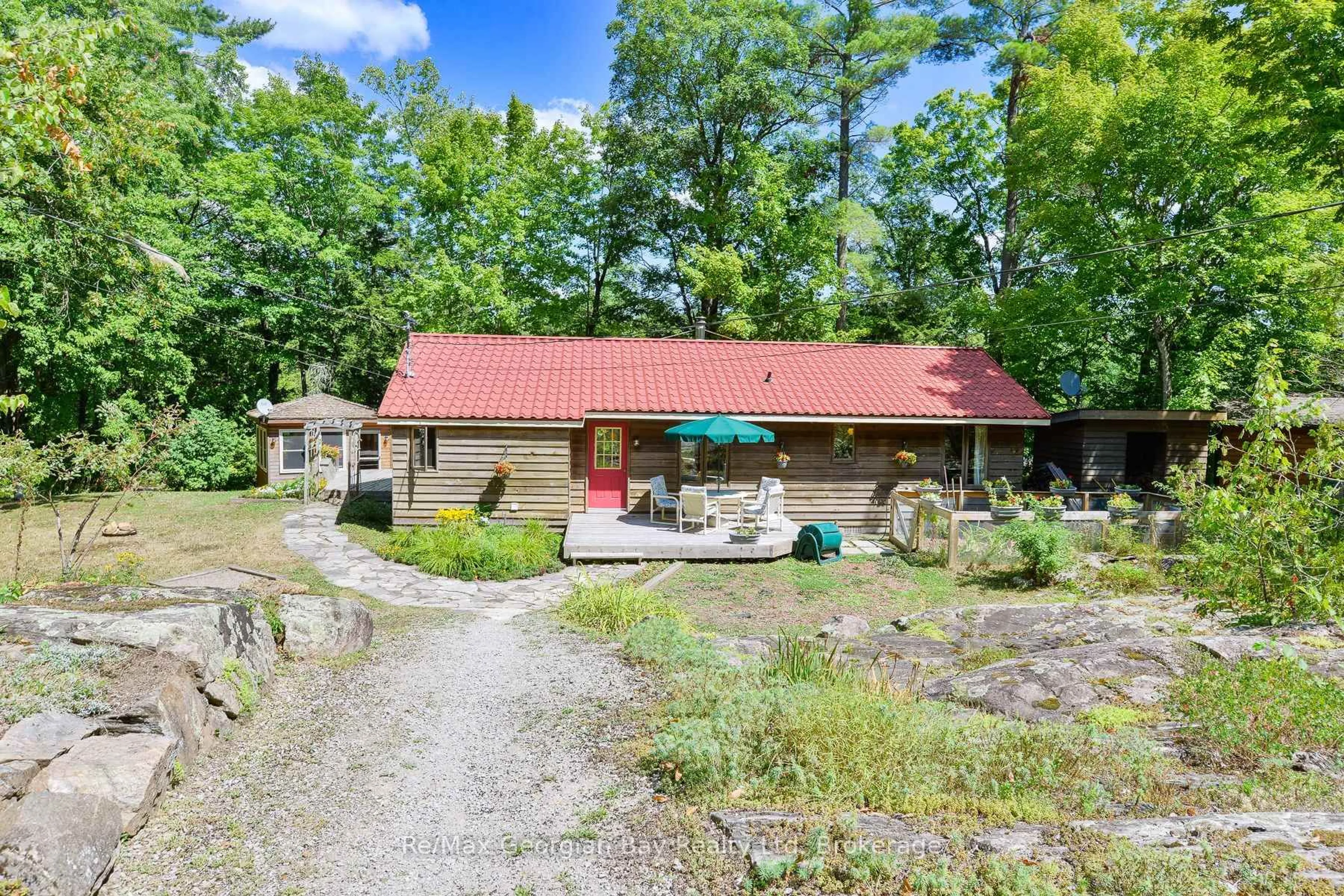 A pic from outside/outdoor area/front of a property/back of a property/a pic from drone, water/lake/river/ocean view for 135 JOHN BUCHLER Rd, Georgian Bay Ontario L0K 1E0