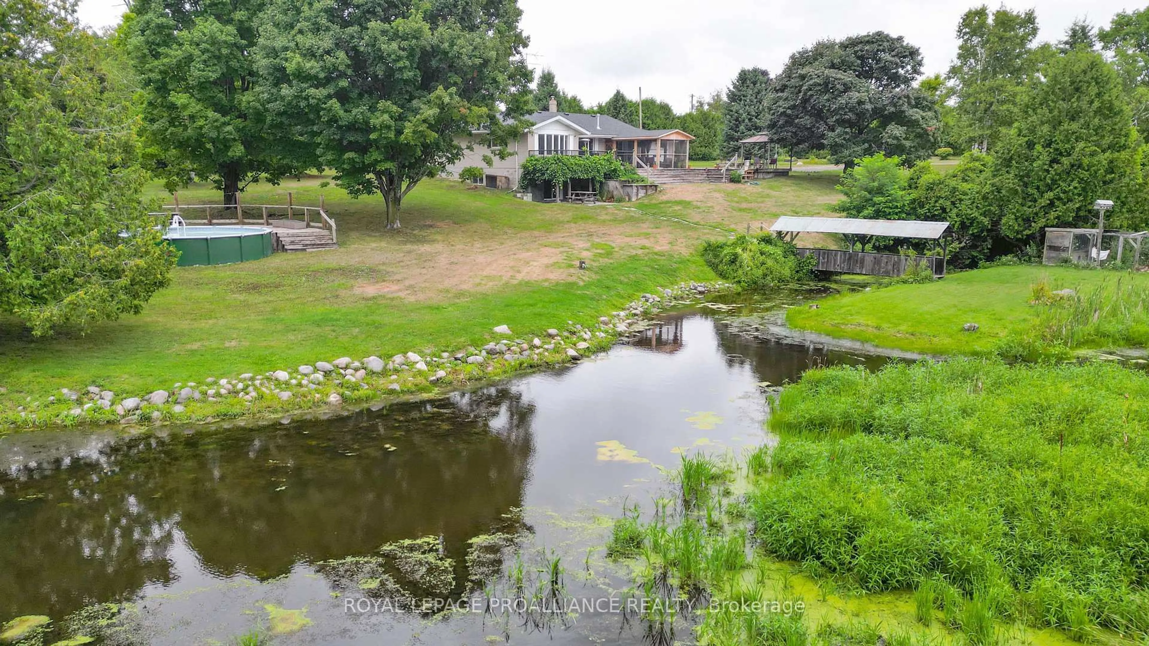A pic from outside/outdoor area/front of a property/back of a property/a pic from drone, water/lake/river/ocean view for 486 Waites Rd, Cramahe Ontario K0K 1S0