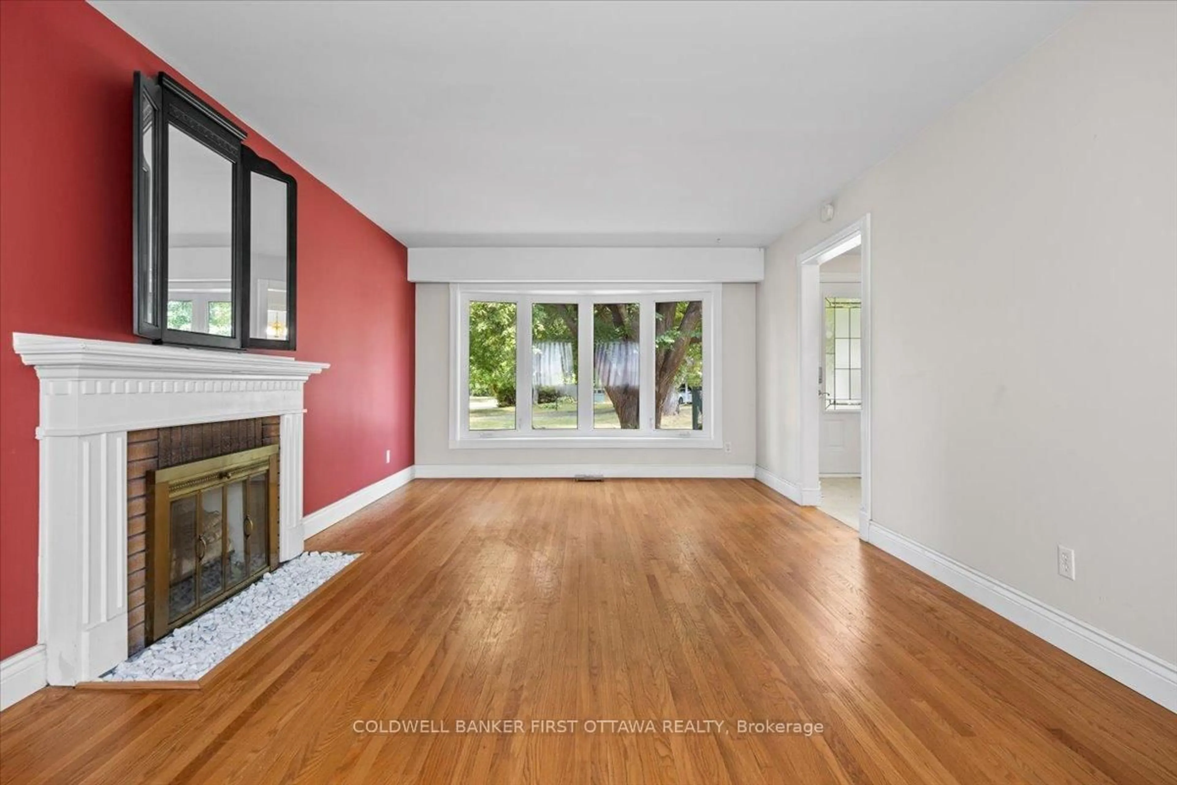 Living room with furniture, wood/laminate floor for 2326 Harding Rd, Ottawa Ontario K1G 3B9