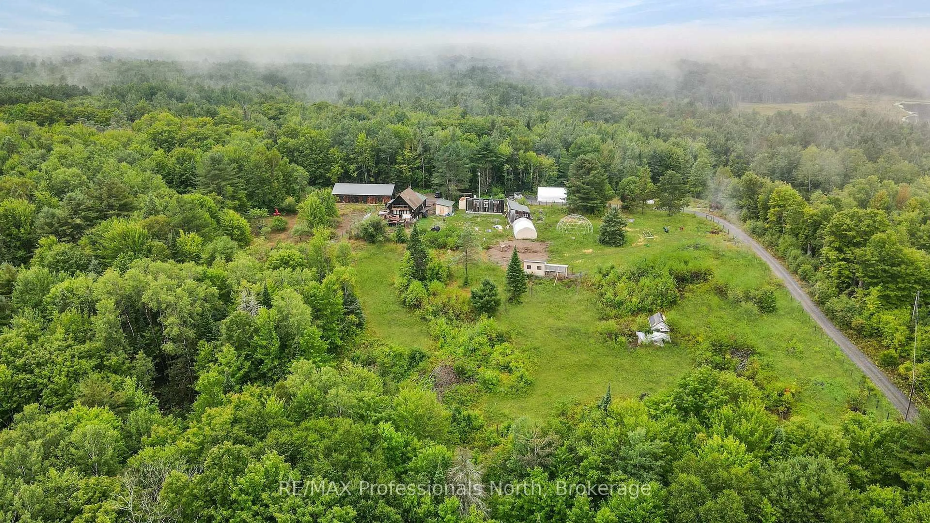 A pic from outside/outdoor area/front of a property/back of a property/a pic from drone, forest/trees view for 1597 Queens Line Rd, Minden Hills Ontario K0M 2K0