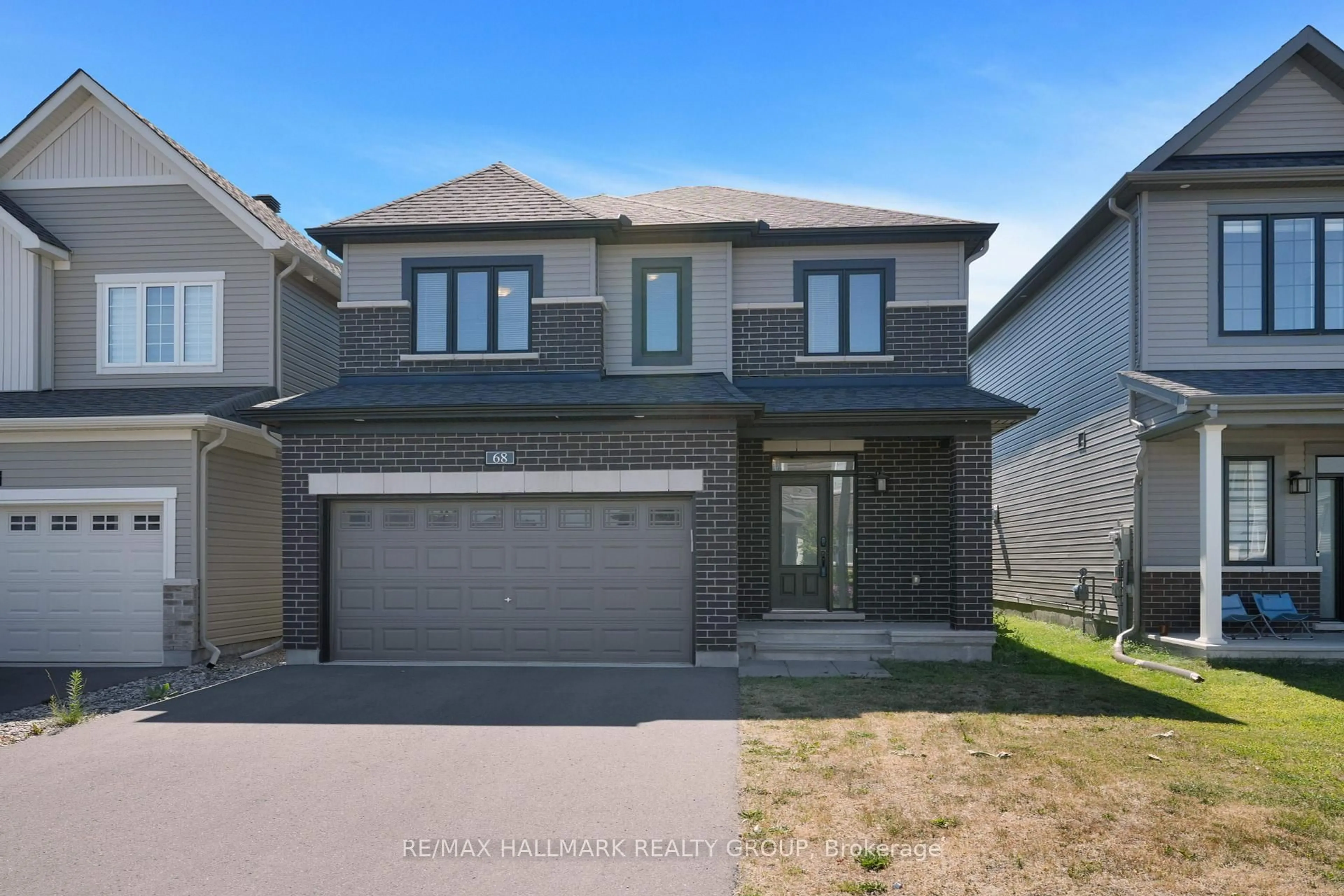 Home with brick exterior material, street for 68 Ralph Erfle Way, Ottawa Ontario K2J 6V5