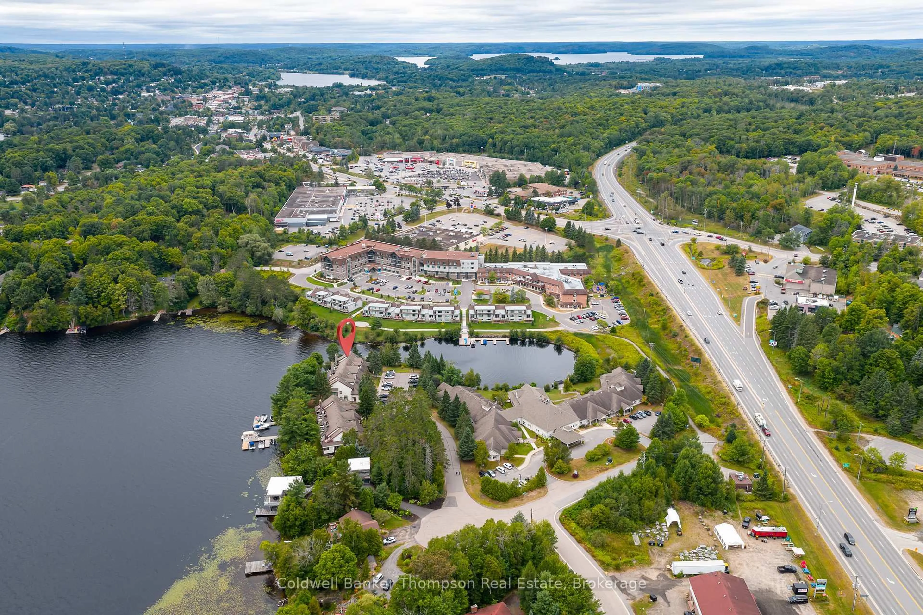 A pic from outside/outdoor area/front of a property/back of a property/a pic from drone, water/lake/river/ocean view for 10 Coveside Dr #204, Huntsville Ontario P1H 1C3