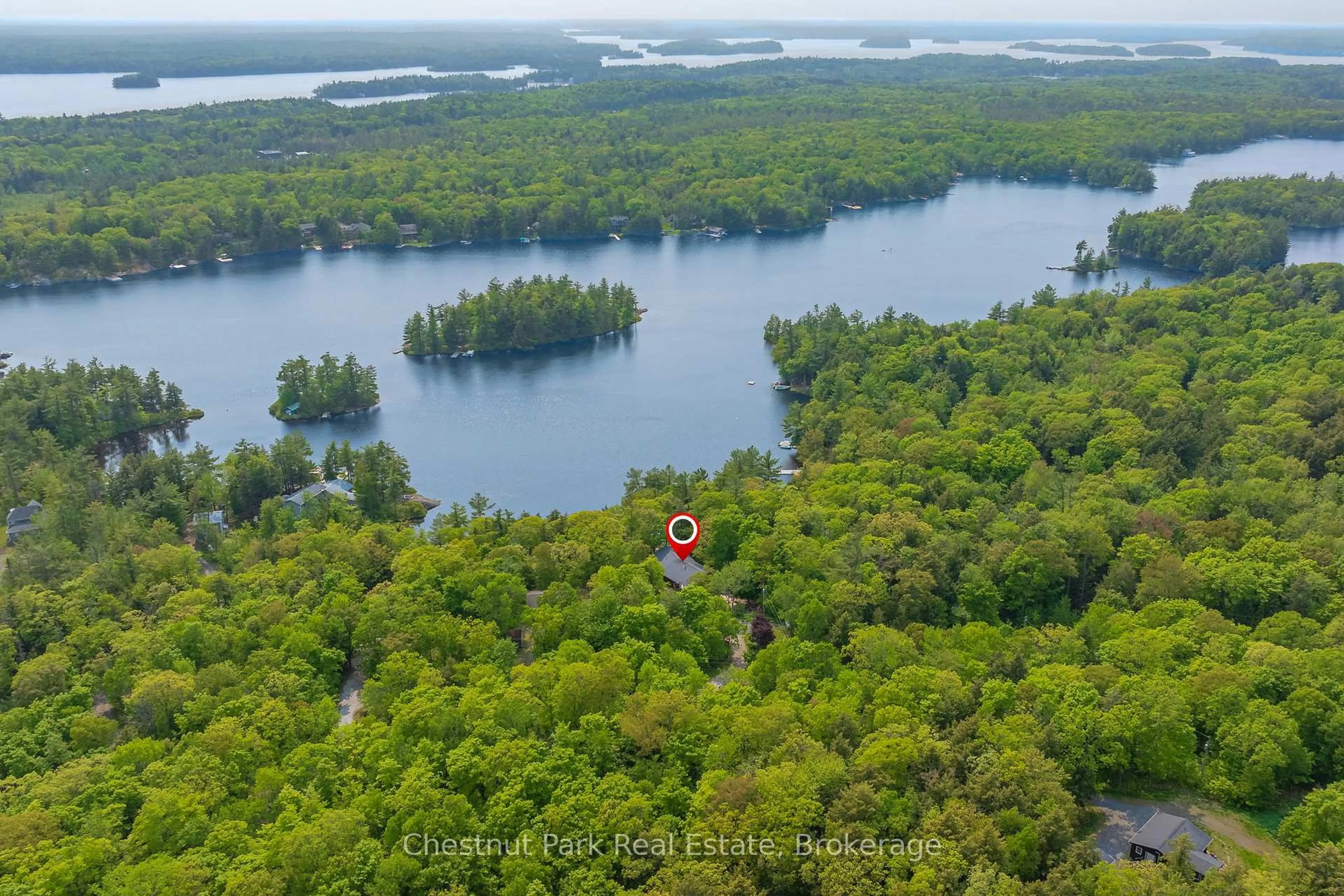 A pic from outside/outdoor area/front of a property/back of a property/a pic from drone, water/lake/river/ocean view for 1143 Leonard Lake 1 Rd, Muskoka Lakes Ontario P1L 2G7