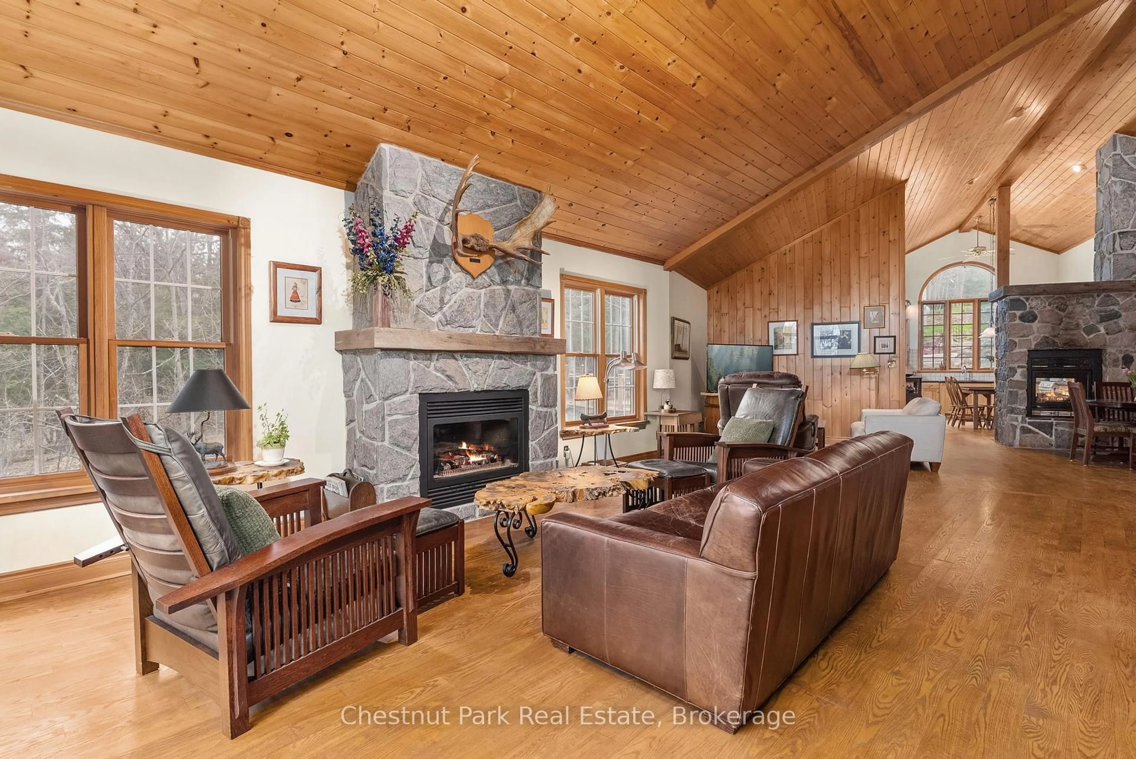 Living room with furniture, wood/laminate floor for 1143 Leonard Lake 1 Rd, Muskoka Lakes Ontario P1L 2G7