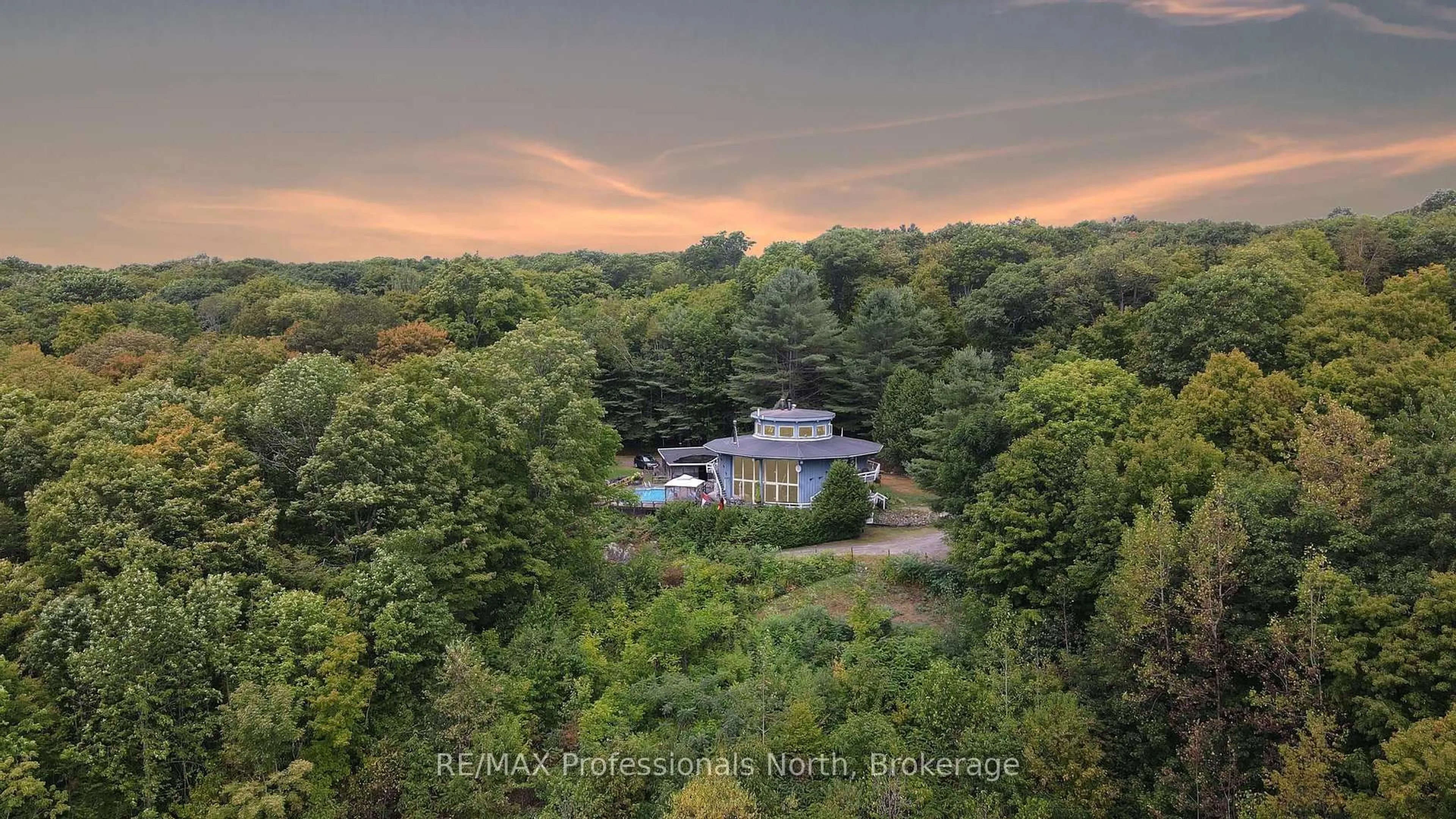 A pic from outside/outdoor area/front of a property/back of a property/a pic from drone, water/lake/river/ocean view for 17359 Highway 35, Algonquin Highlands Ontario K0M 1S0