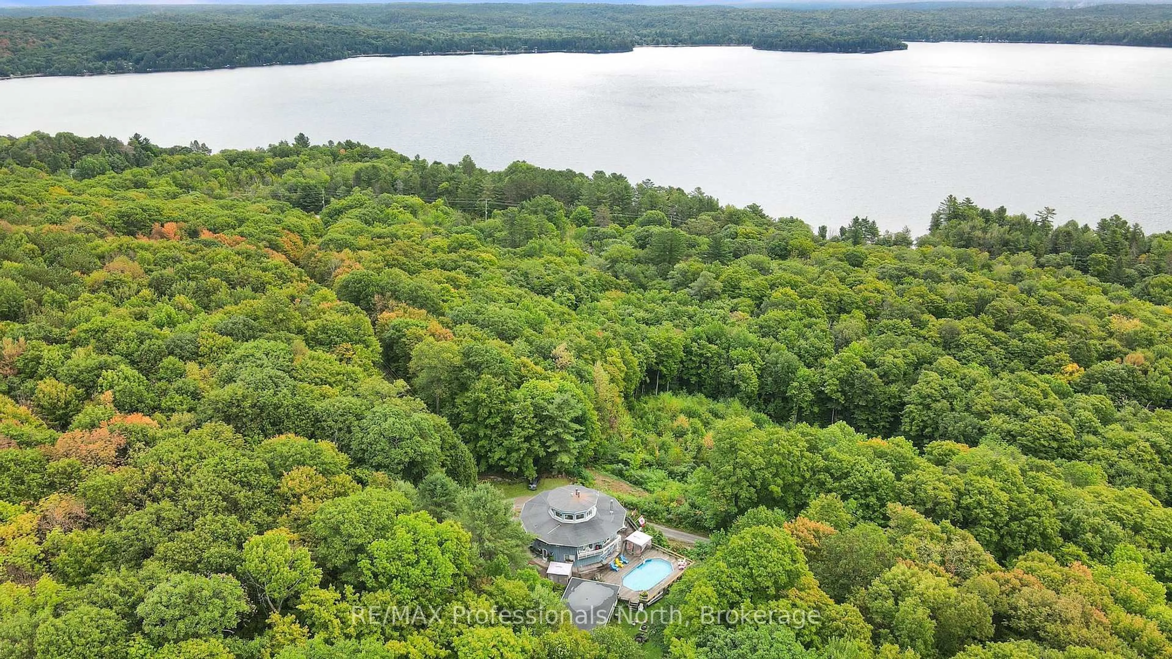 A pic from outside/outdoor area/front of a property/back of a property/a pic from drone, water/lake/river/ocean view for 17359 Highway 35, Algonquin Highlands Ontario K0M 1S0