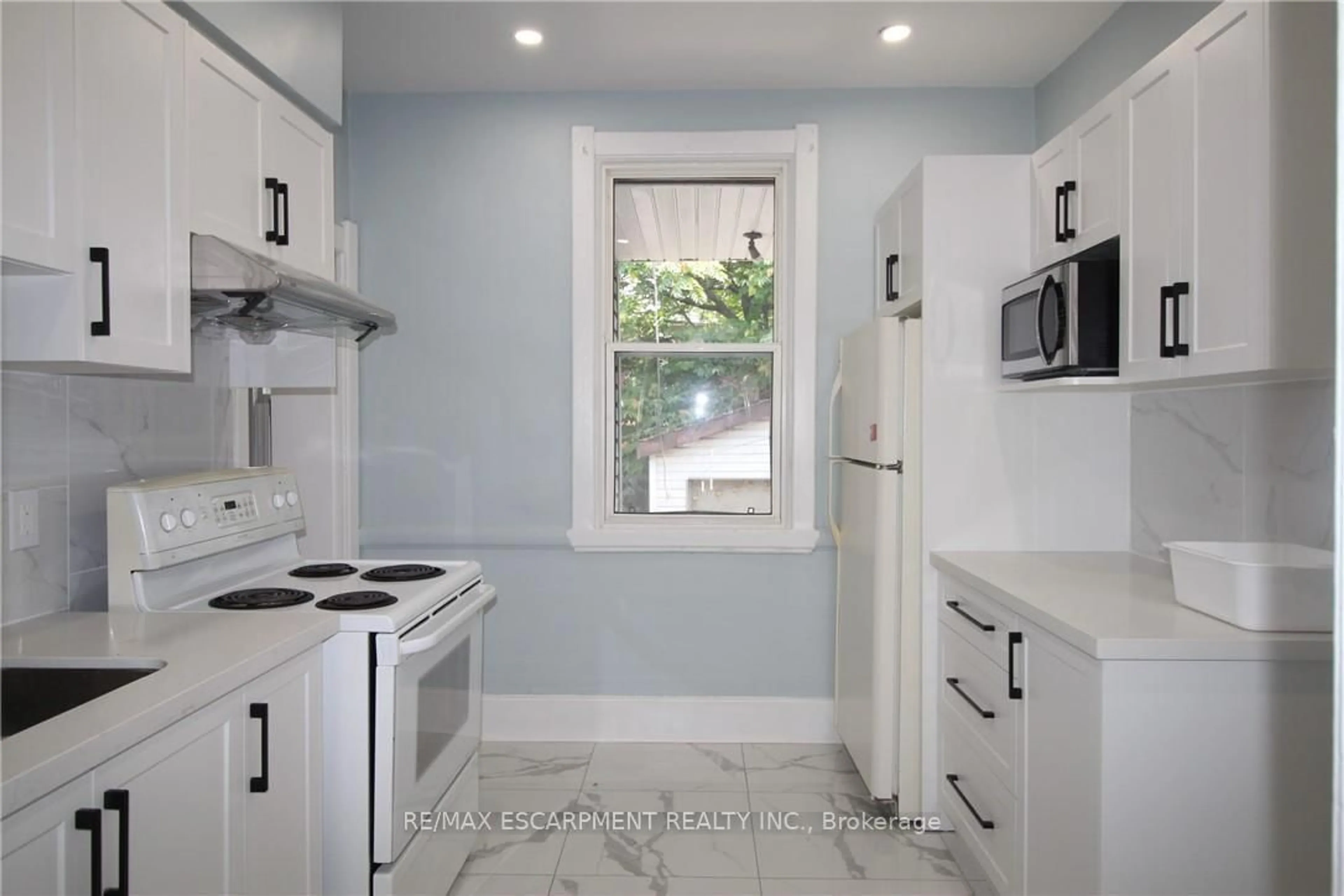 Standard kitchen, ceramic/tile floor for 701 Wilson St, Hamilton Ontario L8L 1V5