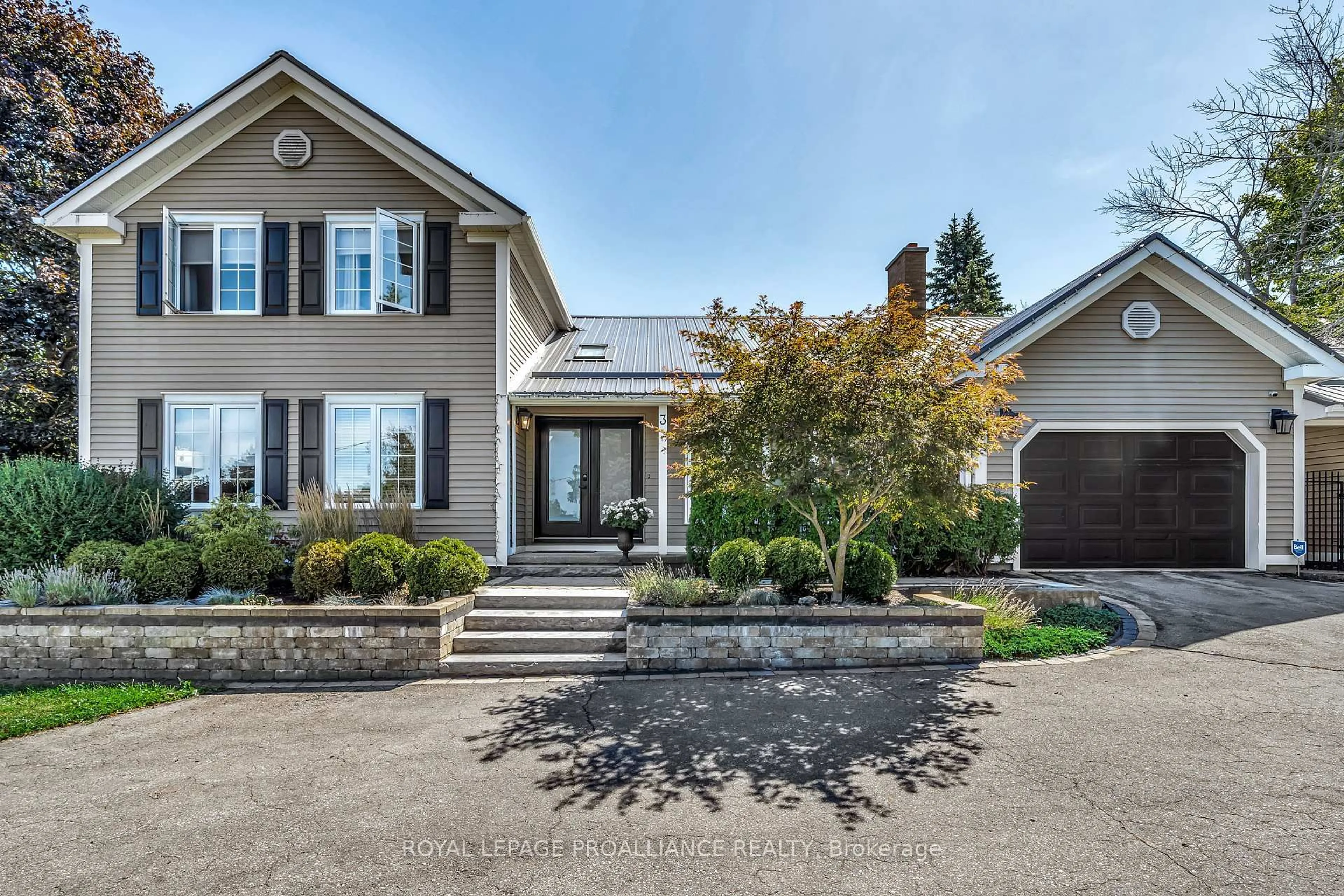 Home with brick exterior material, street for 3 Wesley Acres Rd, Prince Edward County Ontario K0K 1G0