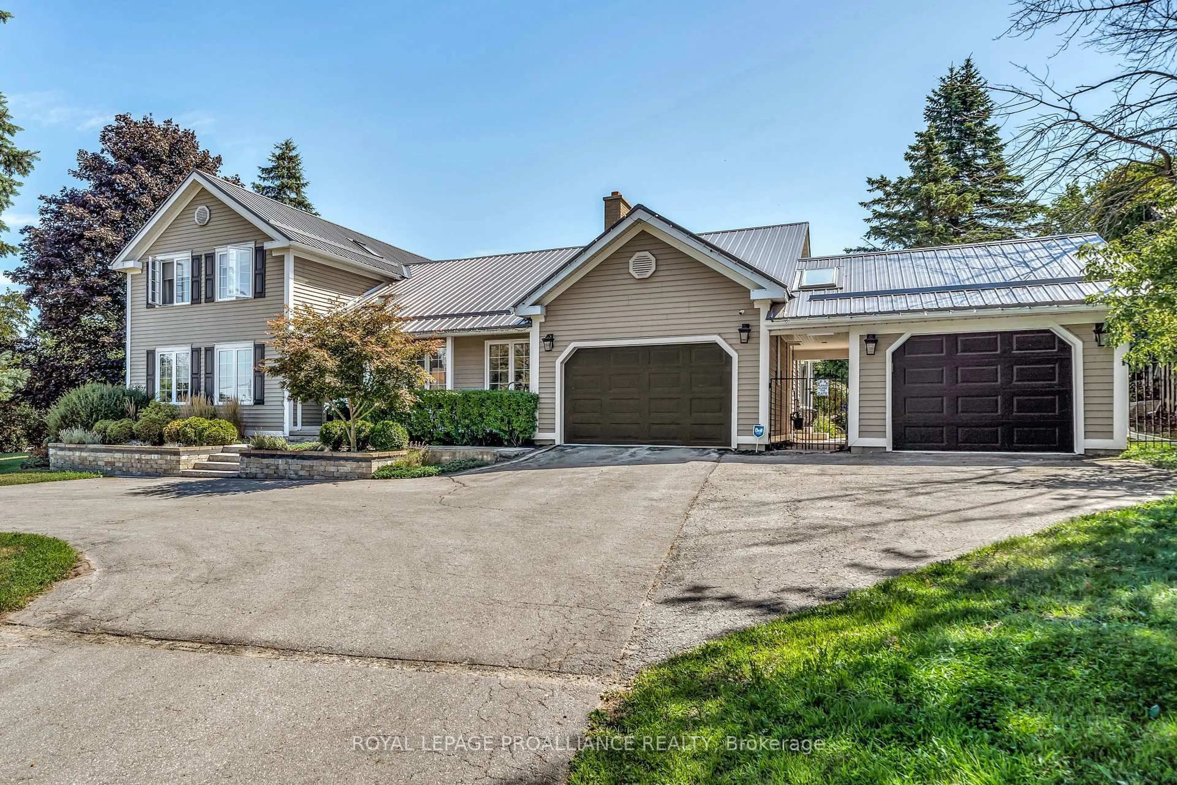 Home with vinyl exterior material, street for 3 Wesley Acres Rd, Prince Edward County Ontario K0K 1G0