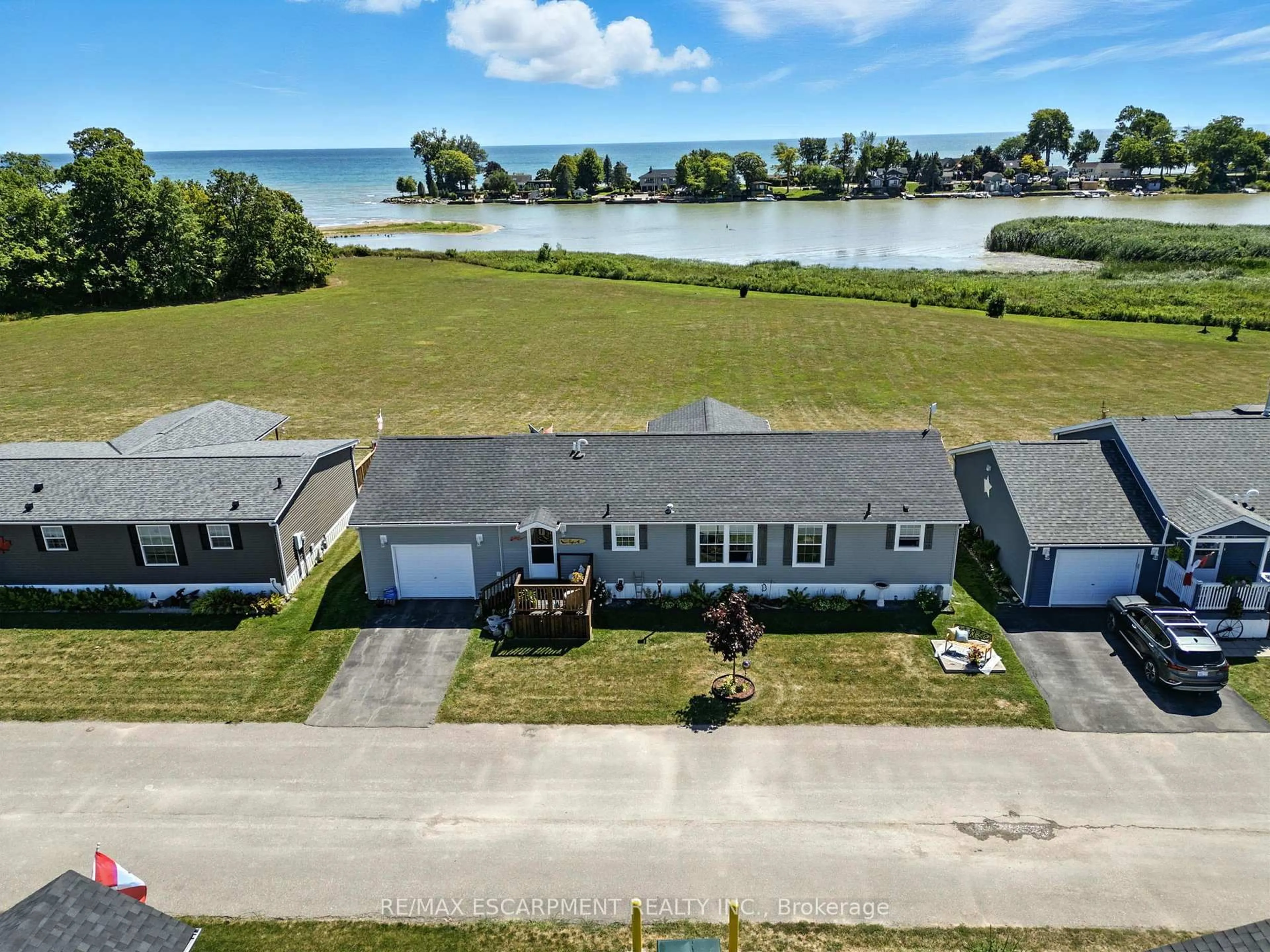 A pic from outside/outdoor area/front of a property/back of a property/a pic from drone, water/lake/river/ocean view for 55 RIVERBEND Cres, Haldimand Ontario N0A 1L0