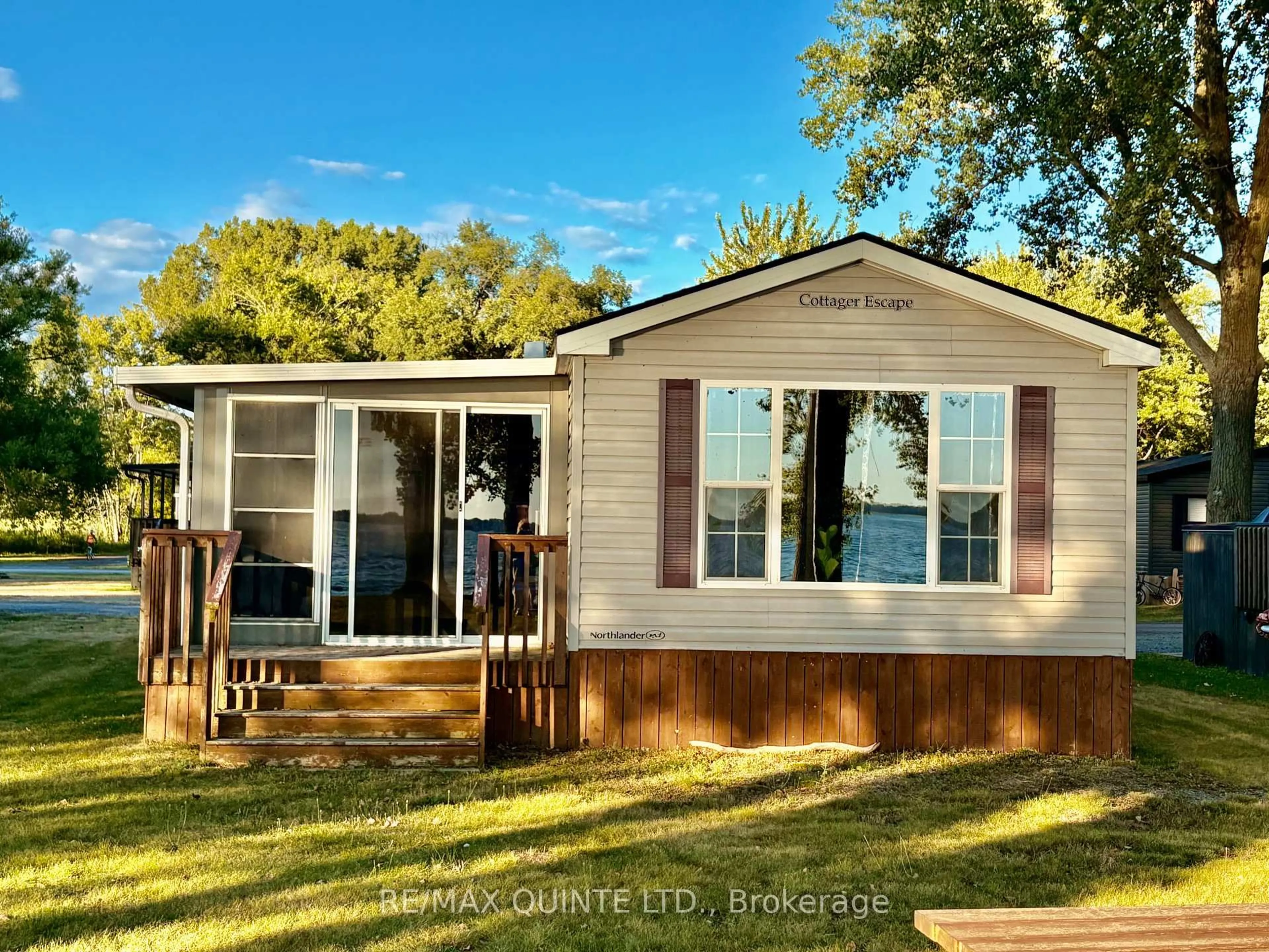 Home with vinyl exterior material, water/lake/river/ocean view for 486 County Rd 18 Rd #23 Beachview Ln, Prince Edward County Ontario K0K 1P0