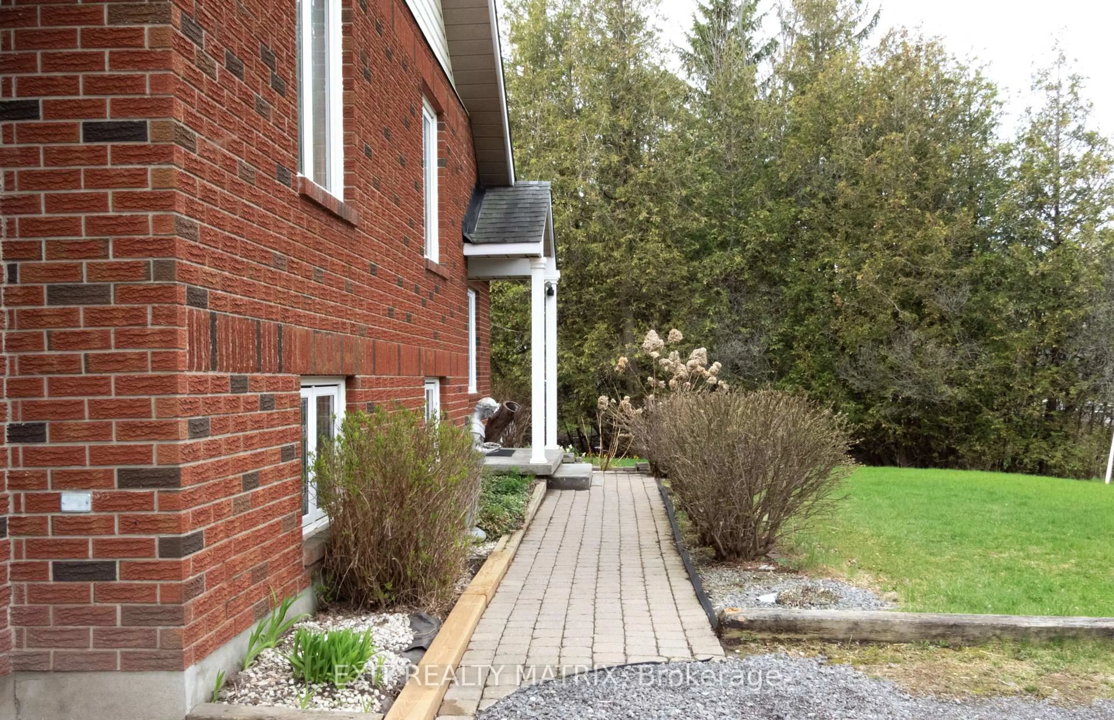 Home with brick exterior material, street for 2418 Rideau Rd, Ottawa Ontario K1X 1B2