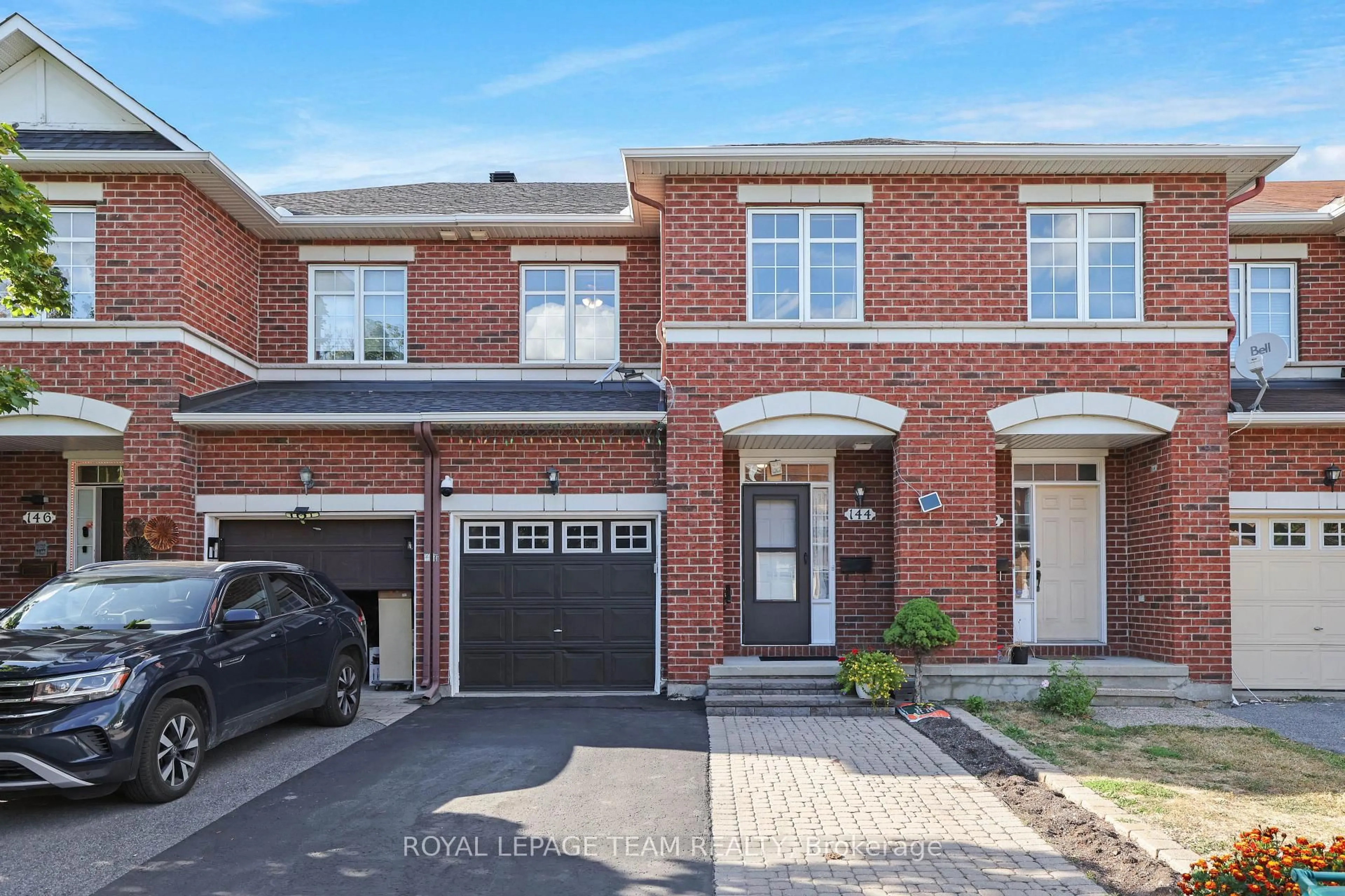 Home with brick exterior material, street for 144 Deercroft Ave, Ottawa Ontario K2J 5H9