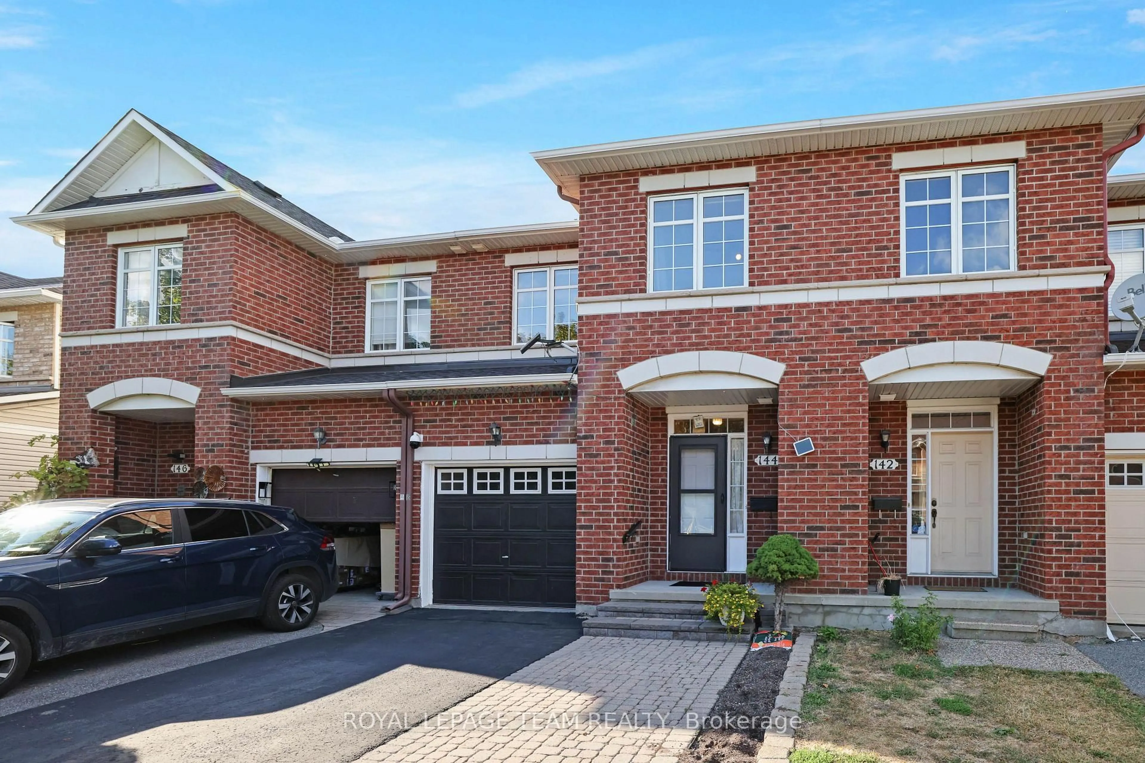 Home with brick exterior material, street for 144 Deercroft Ave, Ottawa Ontario K2J 5H9