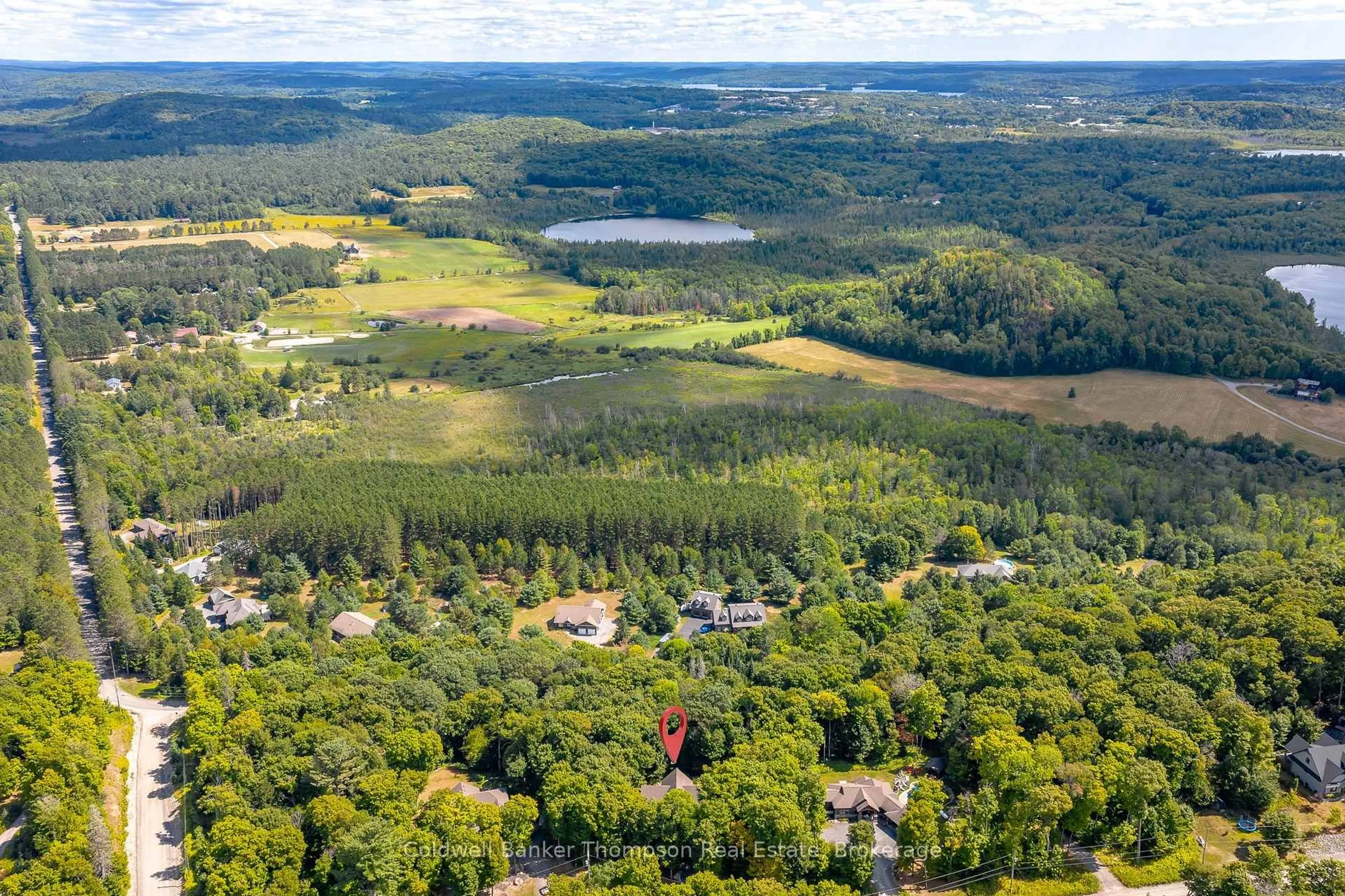 A pic from outside/outdoor area/front of a property/back of a property/a pic from drone, forest/trees view for 11 Forest Hill Lane, Huntsville Ontario P1H 2N5