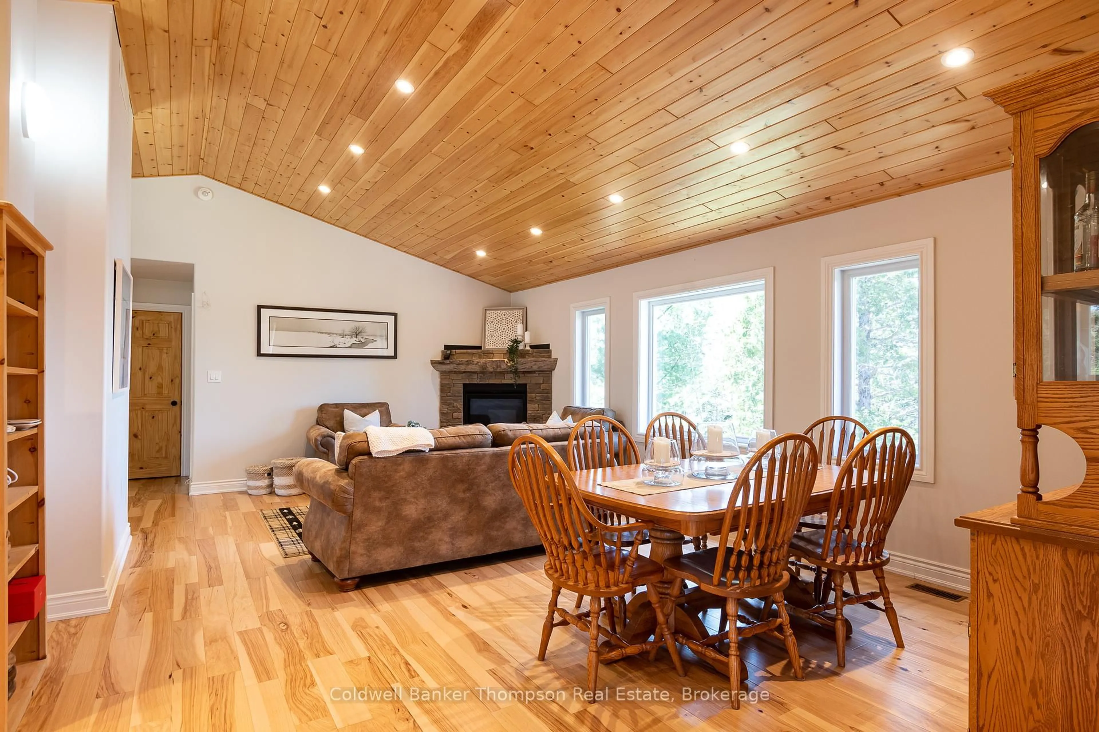 Living room with furniture, wood/laminate floor for 35 Audrey Smith Rd, Magnetawan Ontario P0A 1C0