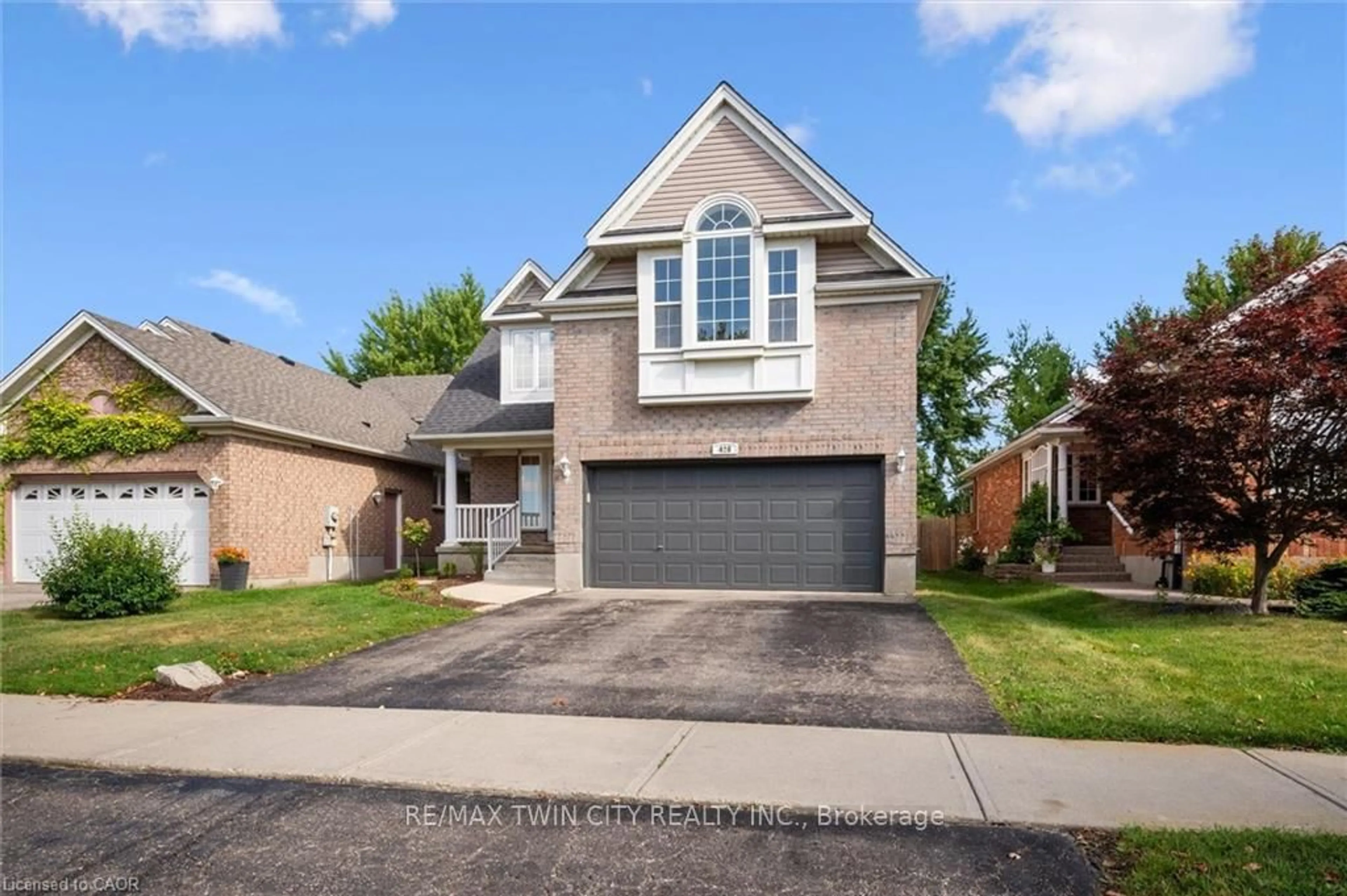 Home with brick exterior material, street for 428 Eastbridge Blvd, Waterloo Ontario N2K 3Y3