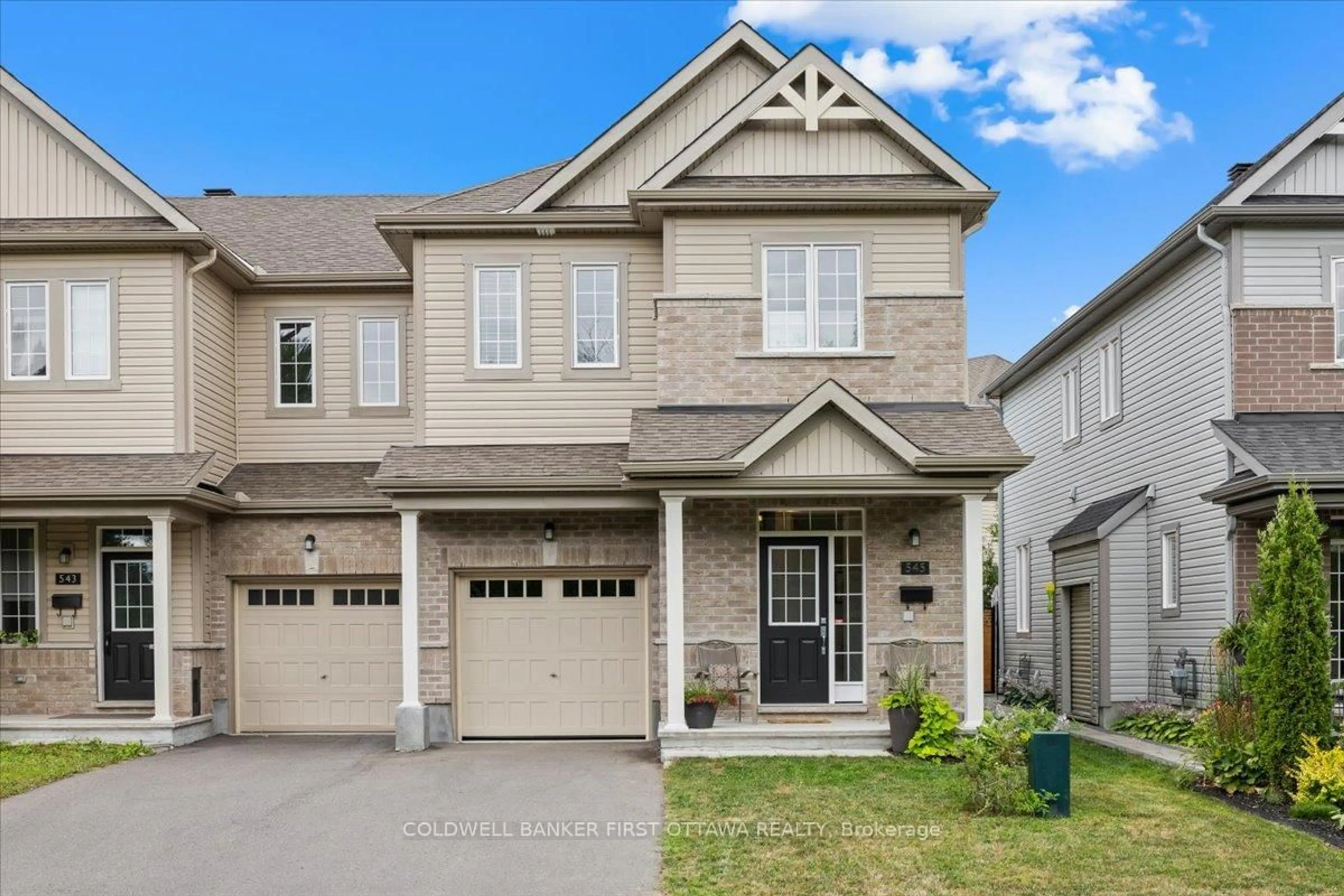 Home with brick exterior material, street for 545 Tulip Tree Way, Ottawa Ontario K1W 0L8