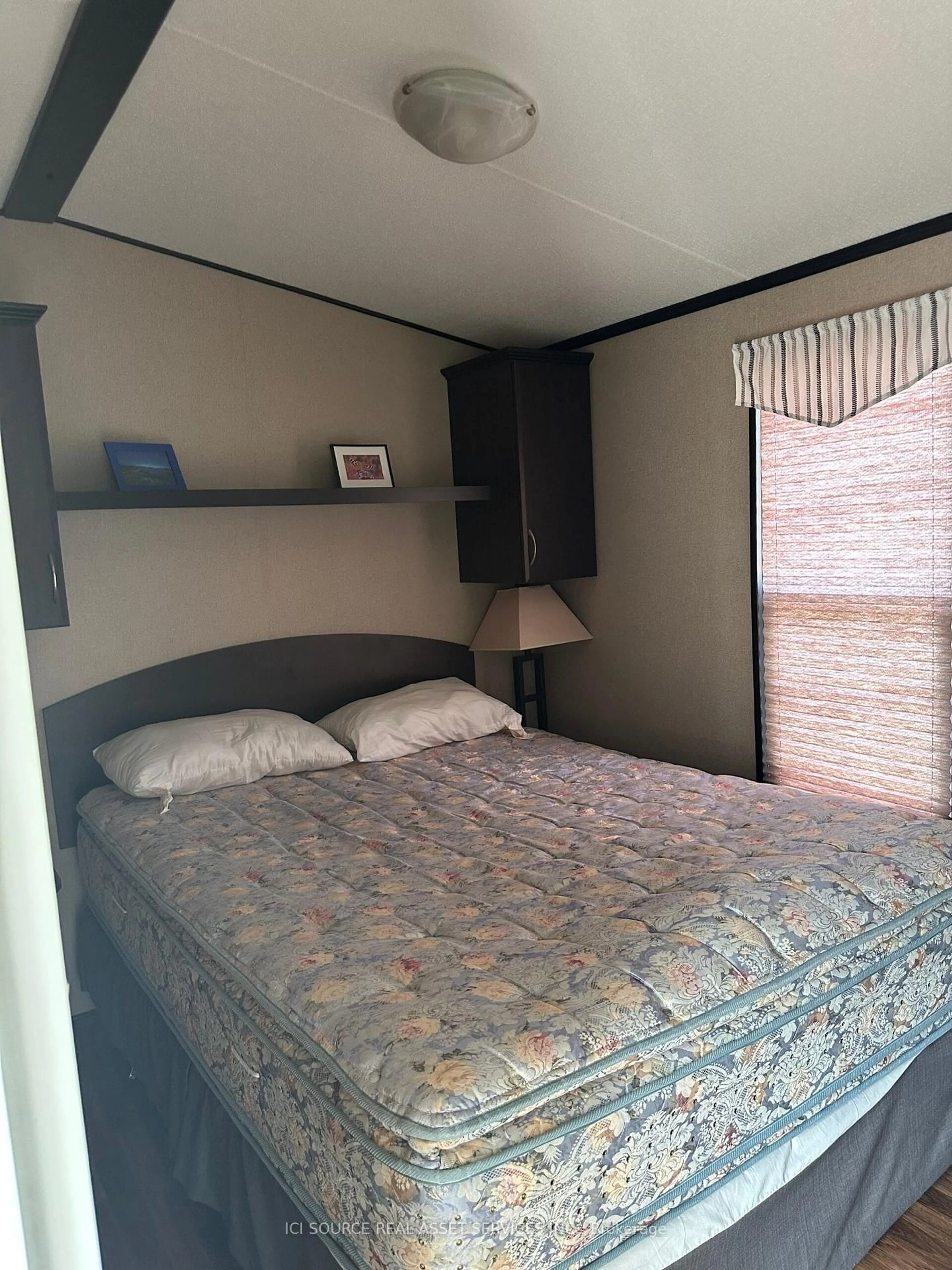 Bedroom with bed, wood/laminate floor for 1501 Line 8 Rd #341, Niagara-on-the-Lake Ontario L0S 1J0
