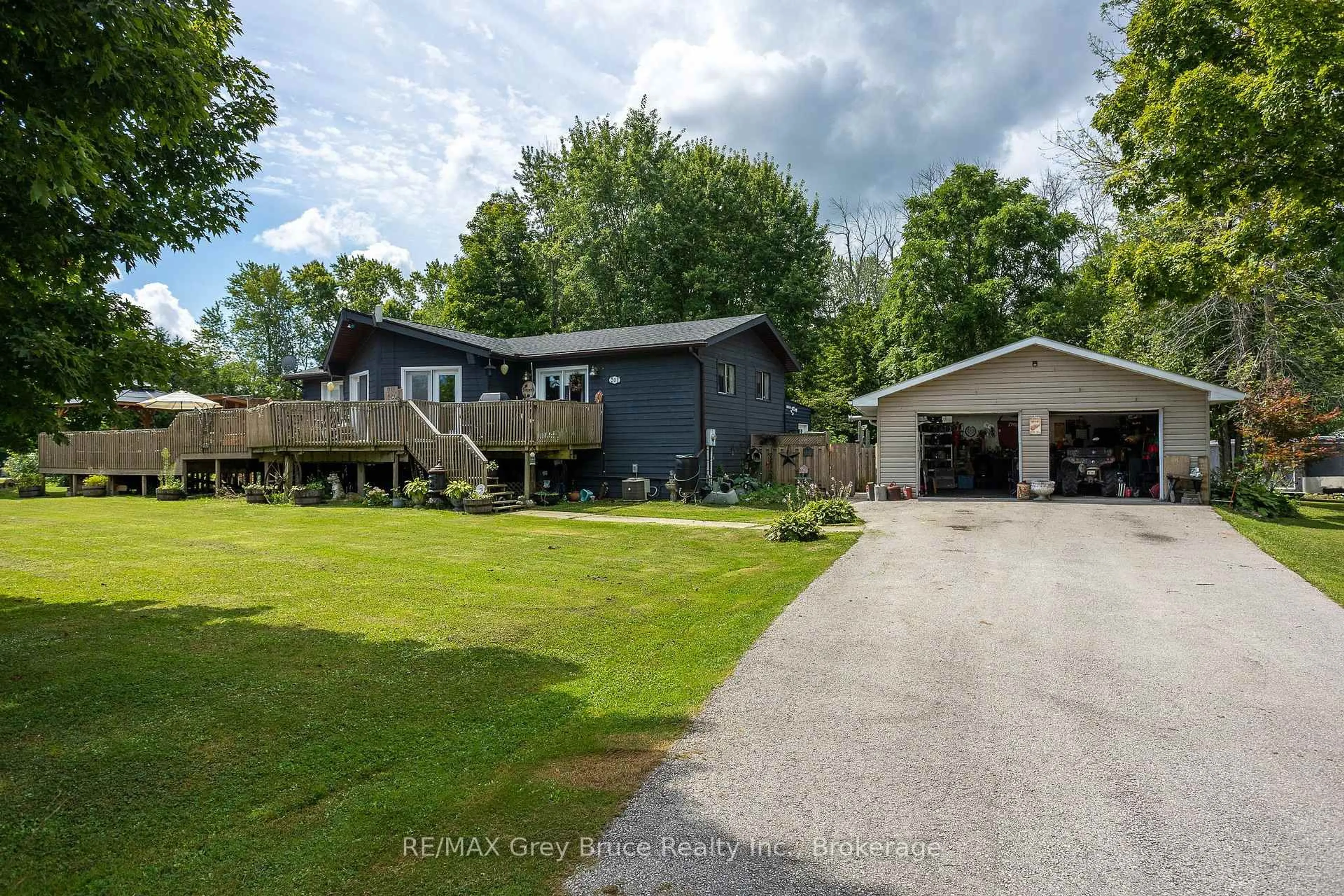 A pic from outside/outdoor area/front of a property/back of a property/a pic from drone, water/lake/river/ocean view for 201 DIVISION St, Georgian Bluffs Ontario N0H 2K0