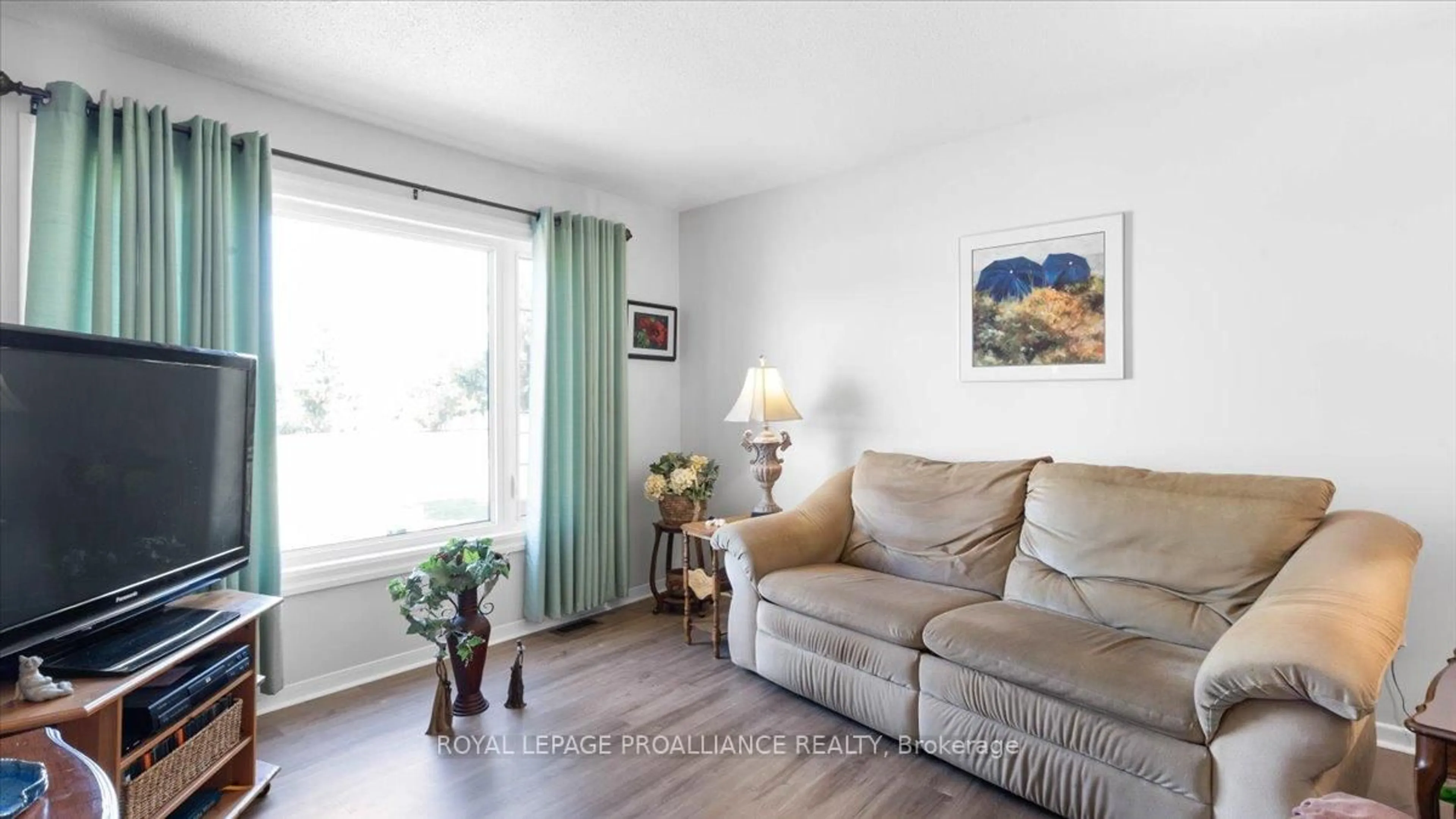 Living room with furniture, wood/laminate floor for 233 Russet Rd, Trent Hills Ontario K0L 1L0
