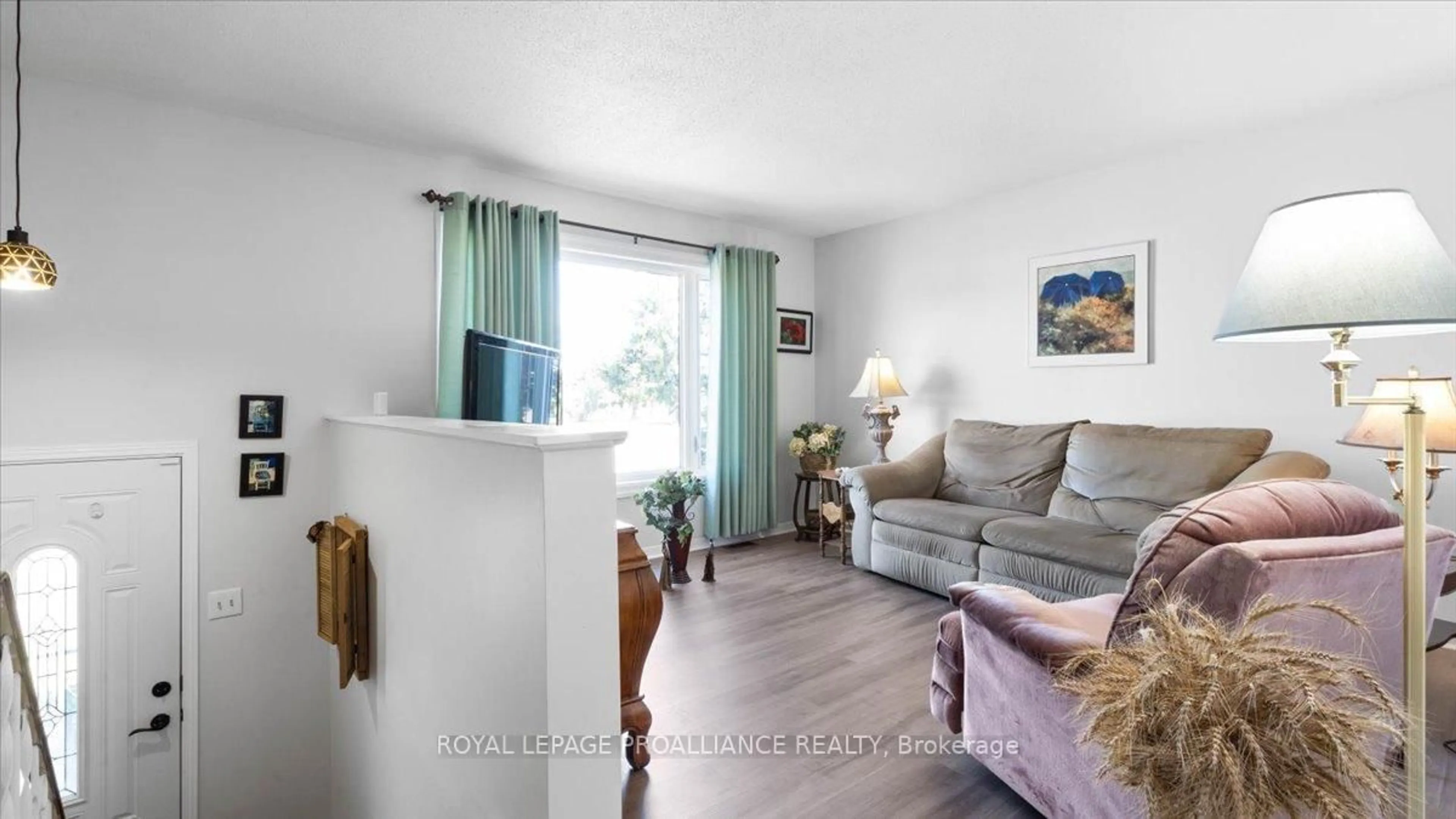Living room with furniture, wood/laminate floor for 233 Russet Rd, Trent Hills Ontario K0L 1L0