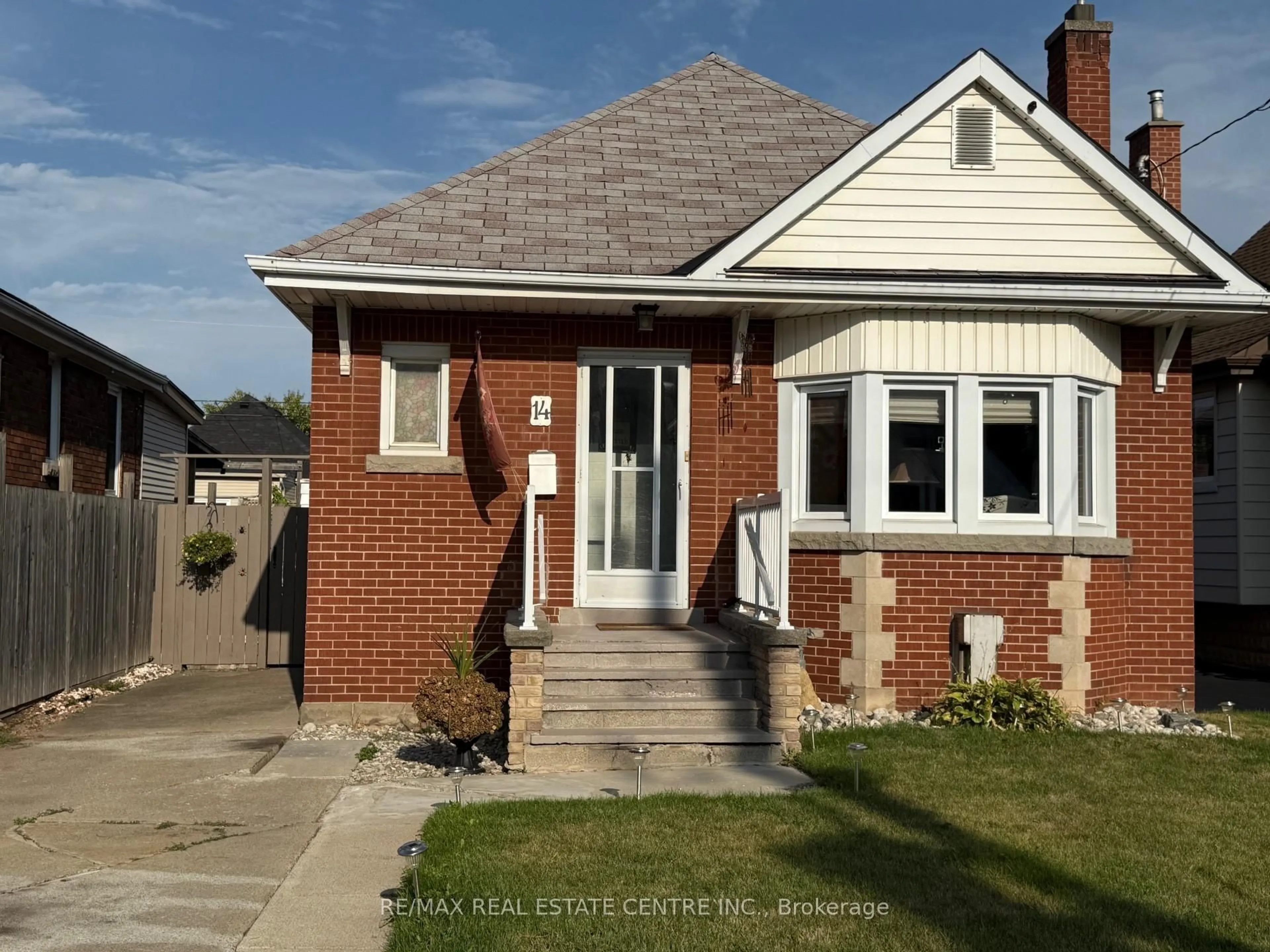 Home with brick exterior material, street for 14 Barons Ave, Hamilton Ontario L8K 2X9