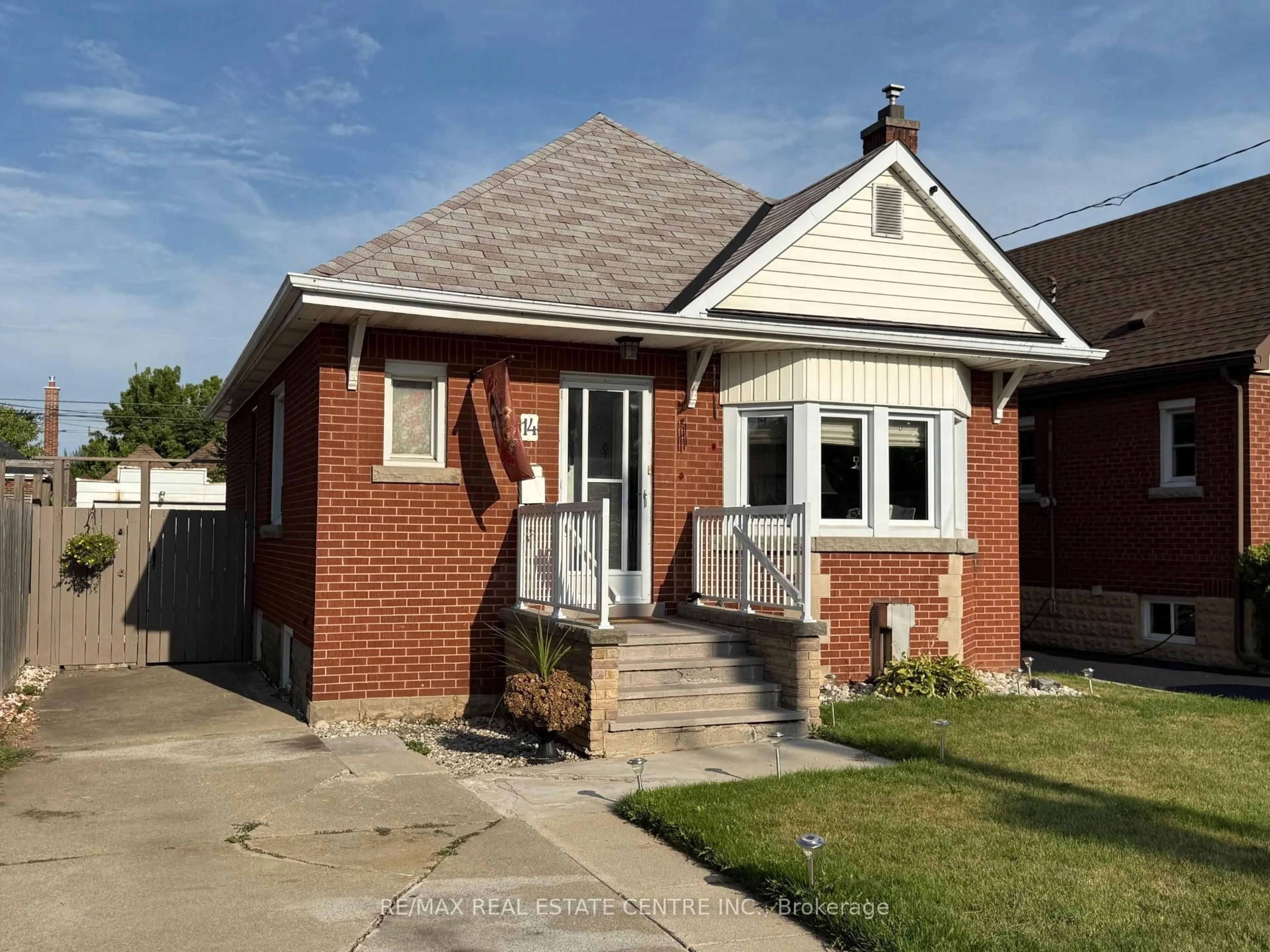 Home with brick exterior material, street for 14 Barons Ave, Hamilton Ontario L8K 2X9