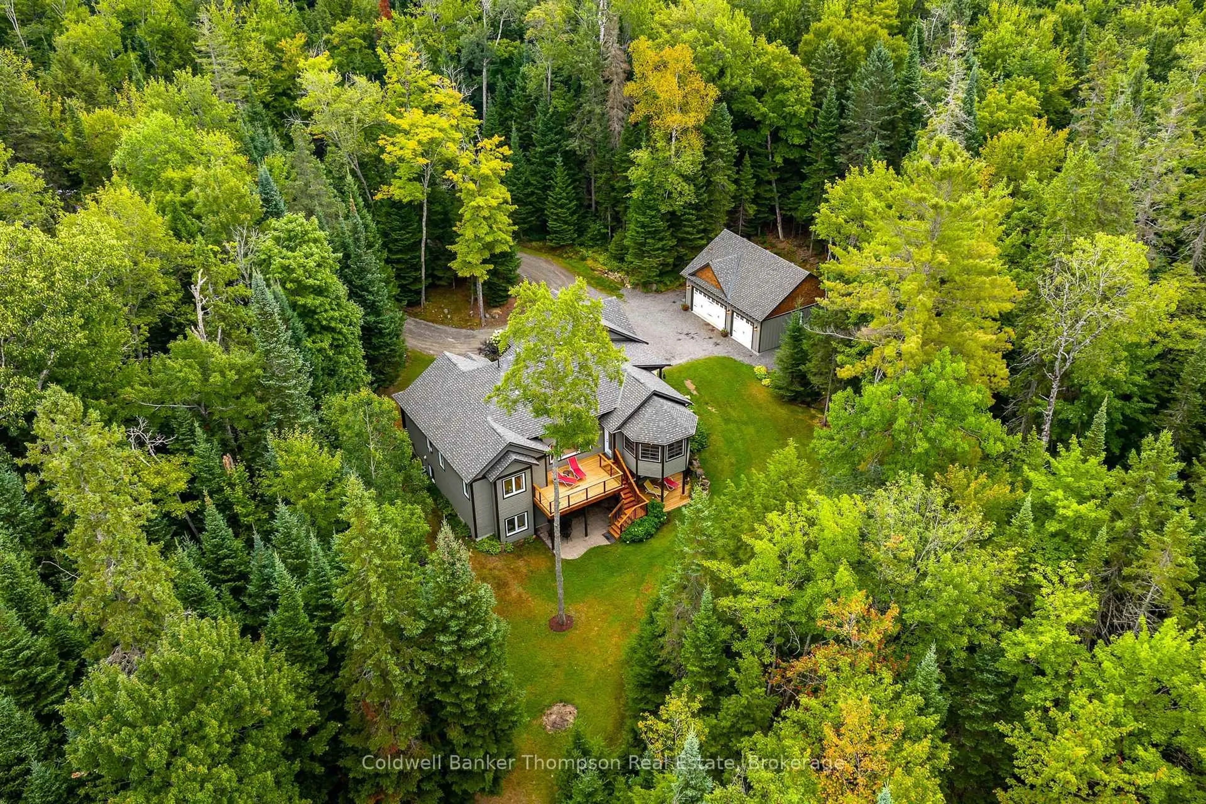 A pic from outside/outdoor area/front of a property/back of a property/a pic from drone, forest/trees view for 78 Orr Rd, Huntsville Ontario P0B 1M0