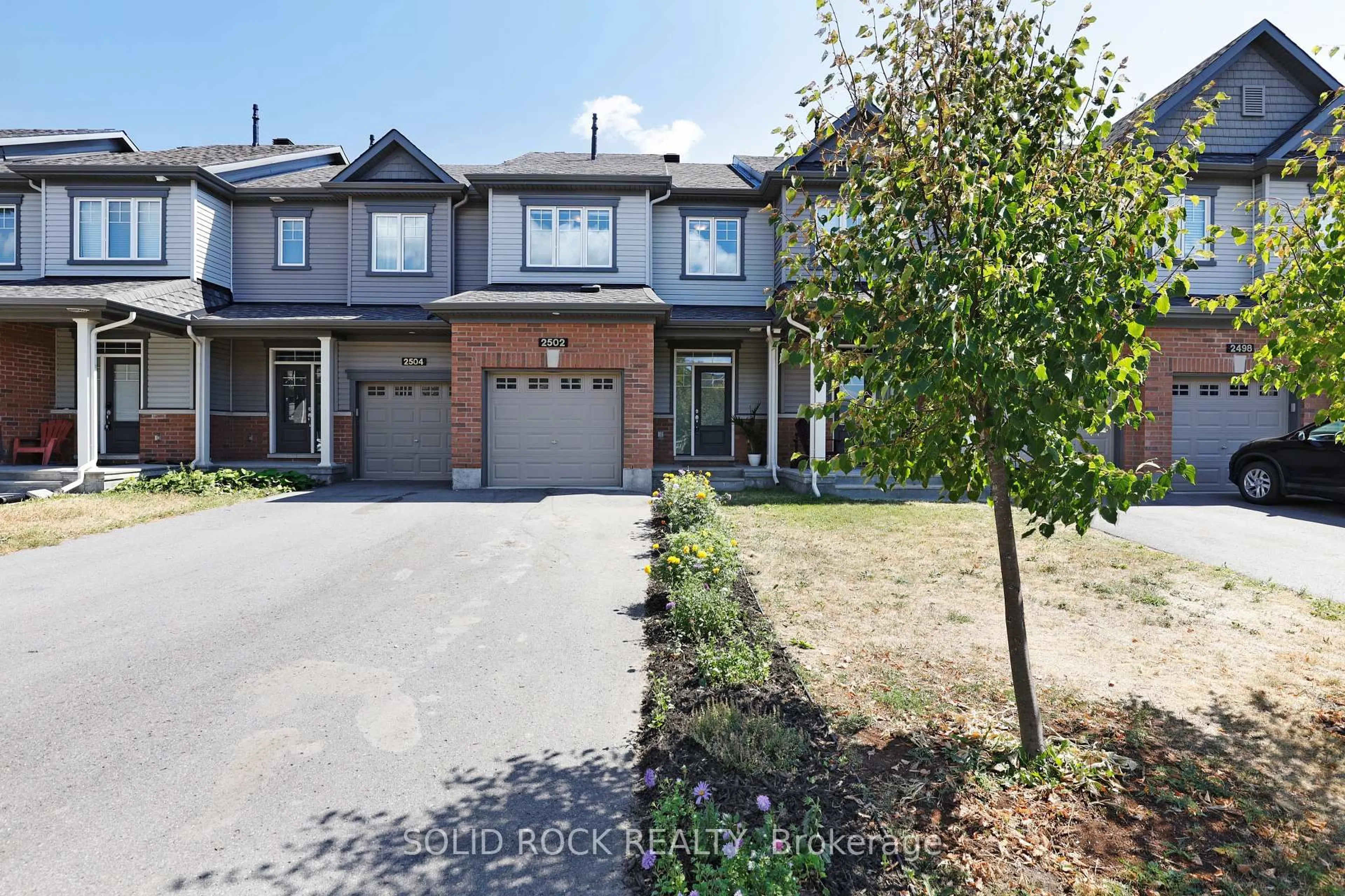 Home with brick exterior material, street for 2502 Waterlilly Way, Nepean Ontario K2J 6M3
