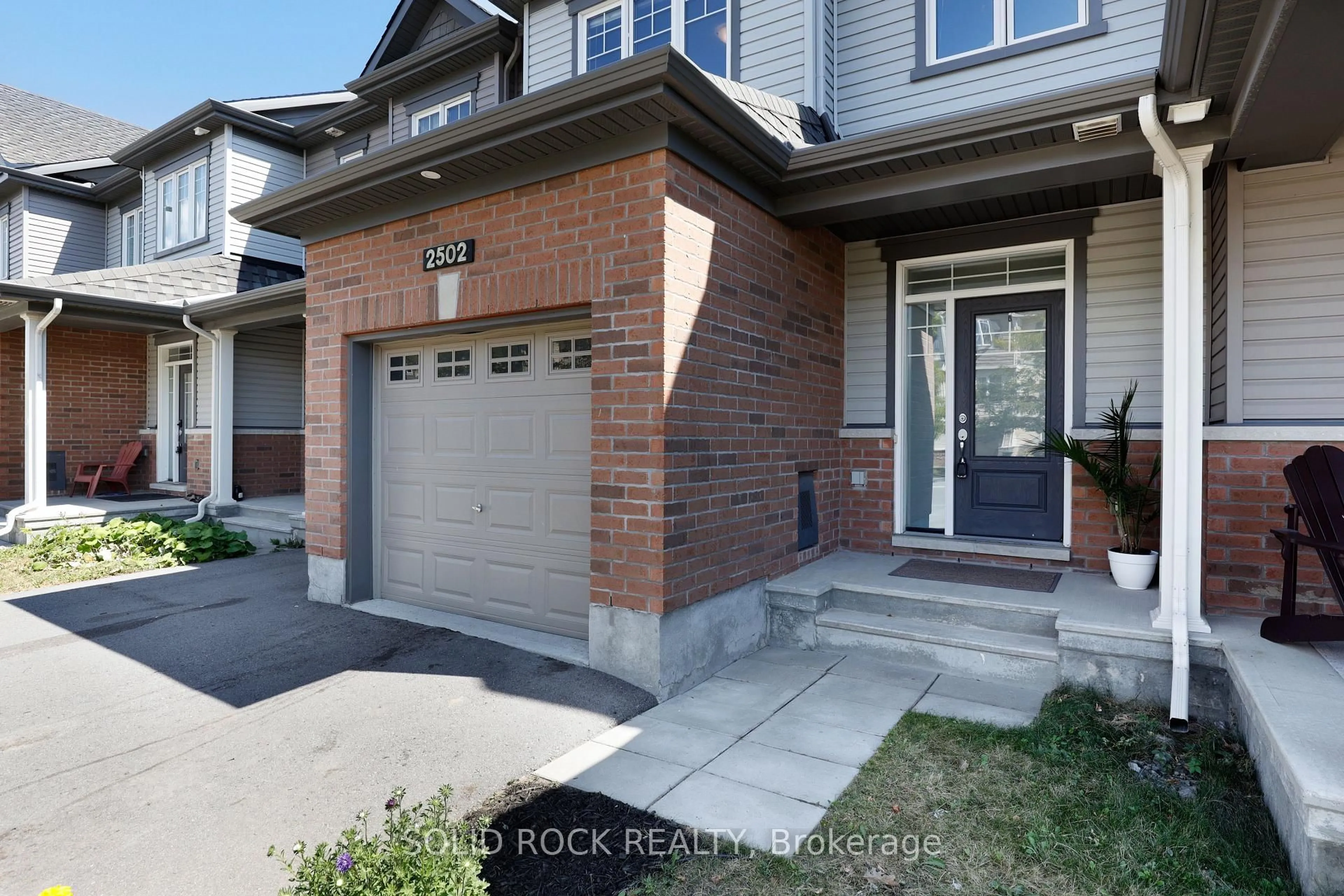Home with brick exterior material, street for 2502 Waterlilly Way, Nepean Ontario K2J 6M3