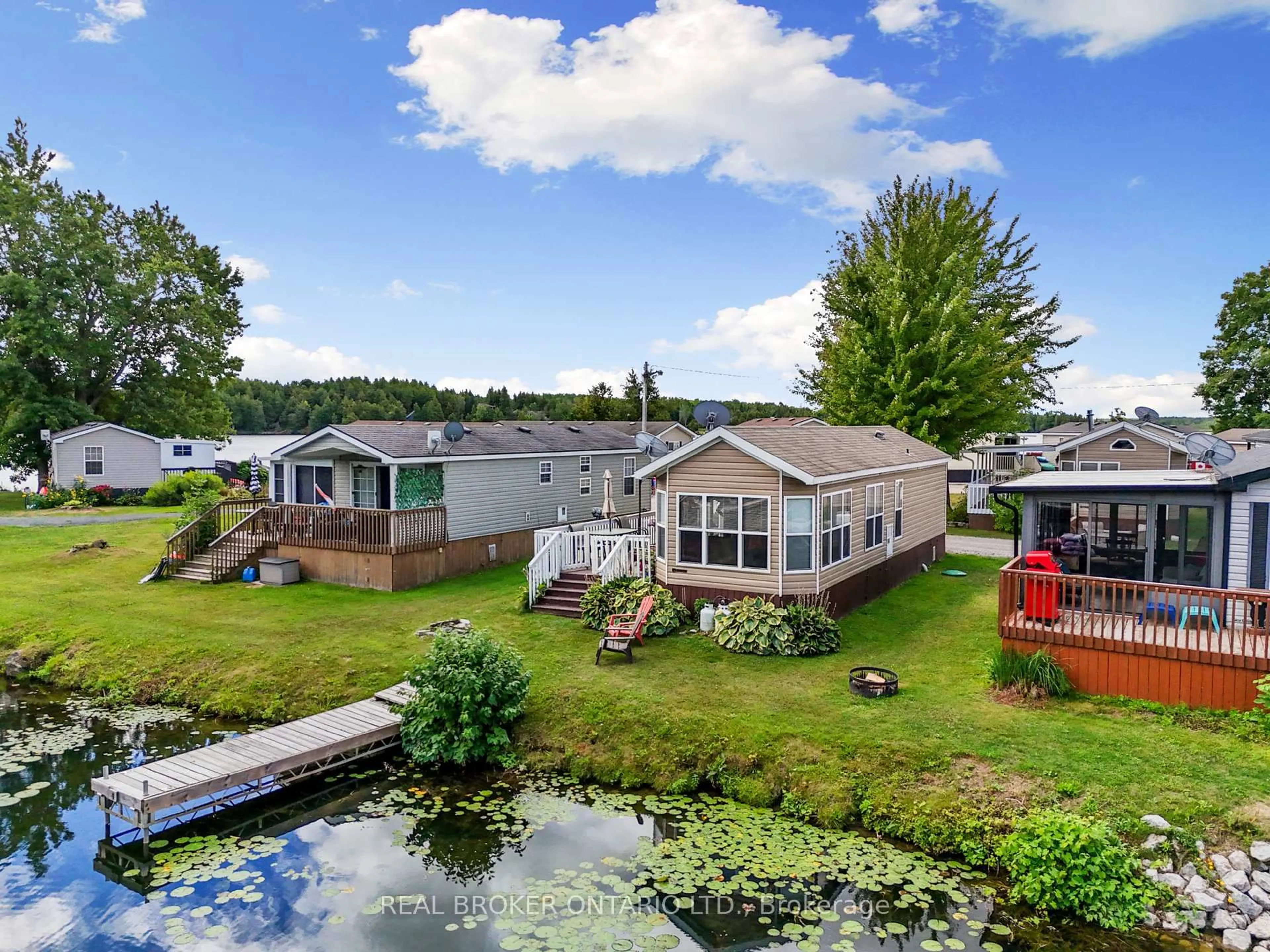 A pic from outside/outdoor area/front of a property/back of a property/a pic from drone, water/lake/river/ocean view for 171 Woodland Estate Rd #CPC7, Trent Hills Ontario K0L 1L0